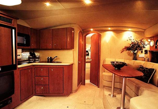 Interior of 2000 Cruisers Yachts 3575 Express with kitchen and seating area.