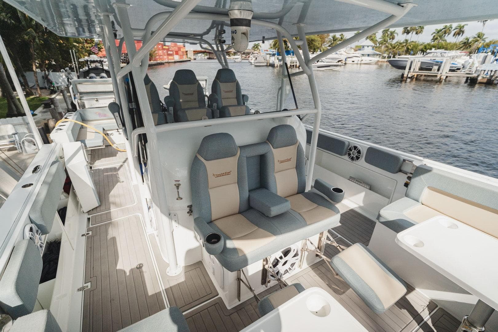 Luxurious 2024 YachtCat 41 interior with plush seating and modern design by the waterfront.
