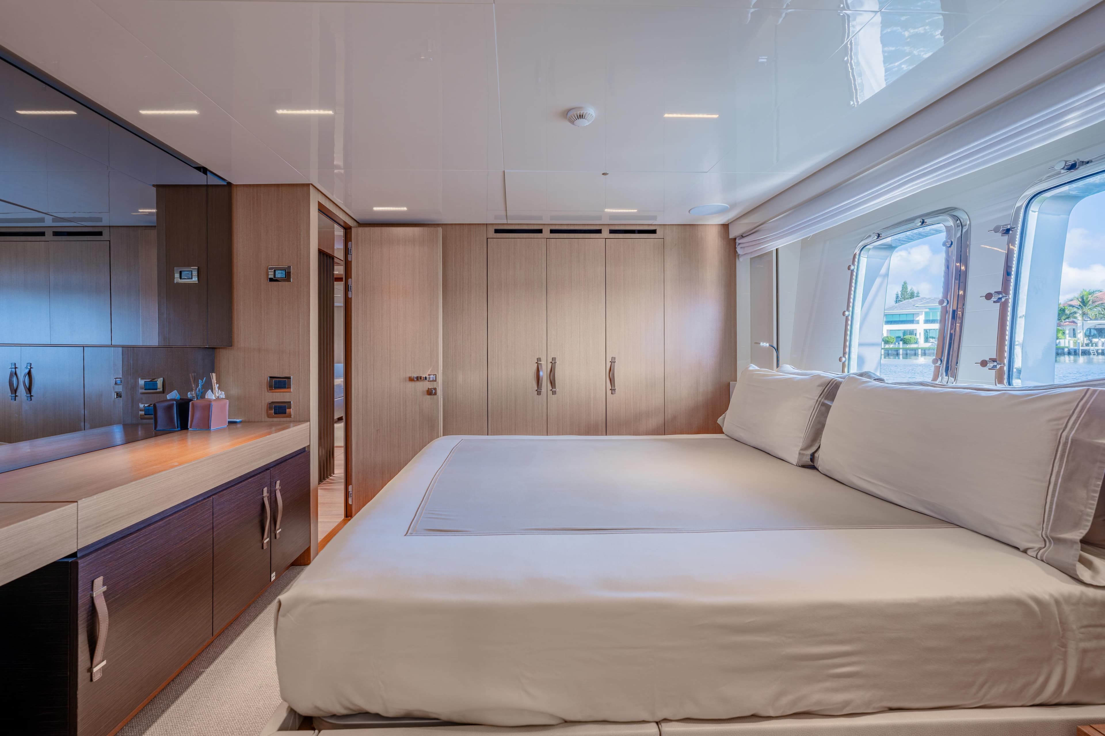 Luxurious bedroom interior of 2023 Sanlorenzo SL120A yacht with modern design and large windows.