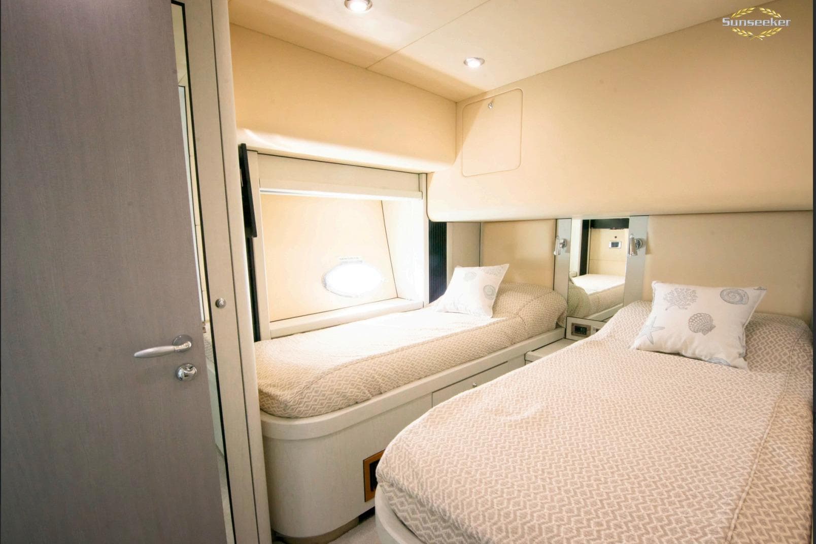 Interior of 2007 Sunseeker Predator 82 yacht with twin beds and modern decor.