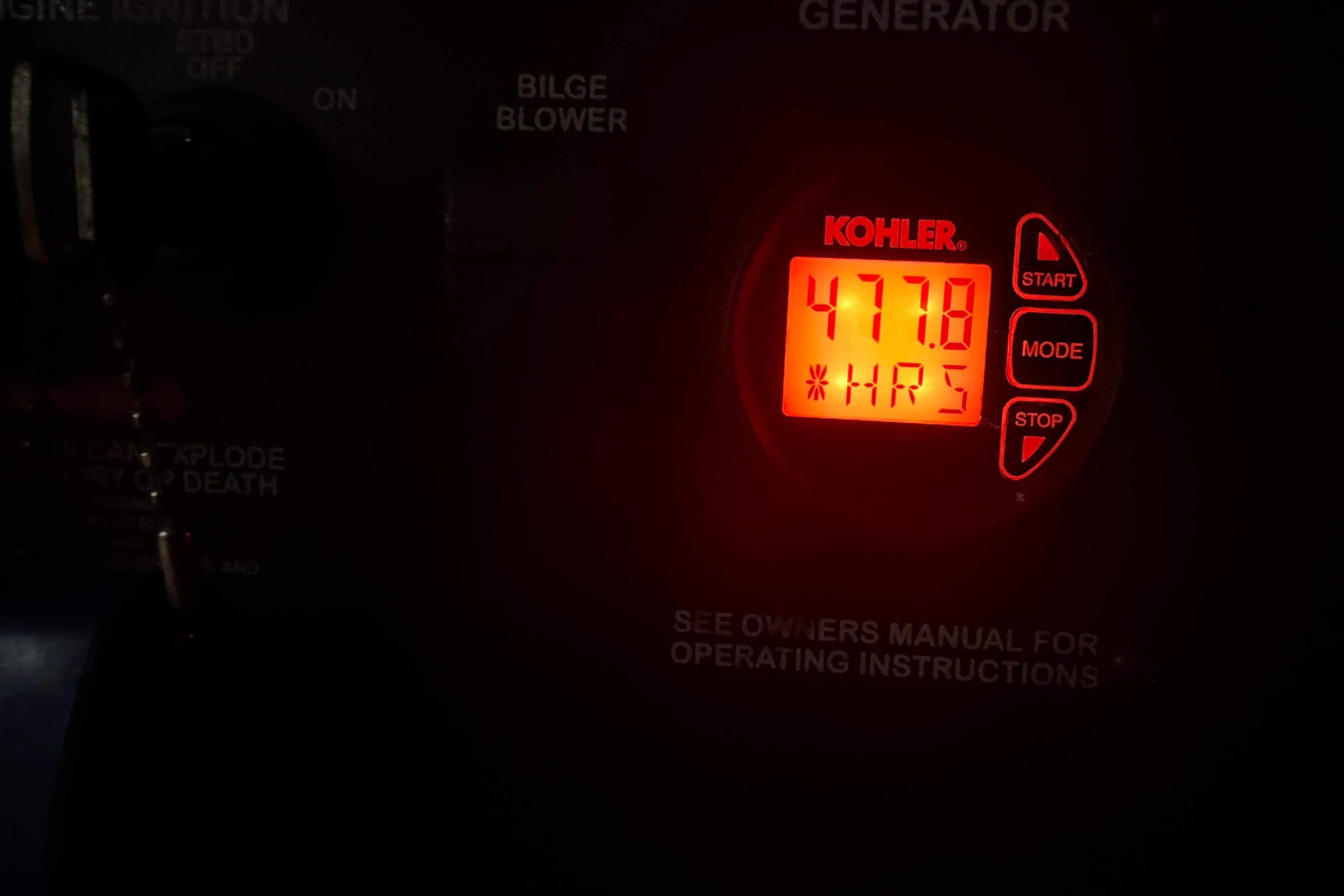 Kohler generator display showing 477.8 hours on a 2012 Sea Ray Sundancer 310.
