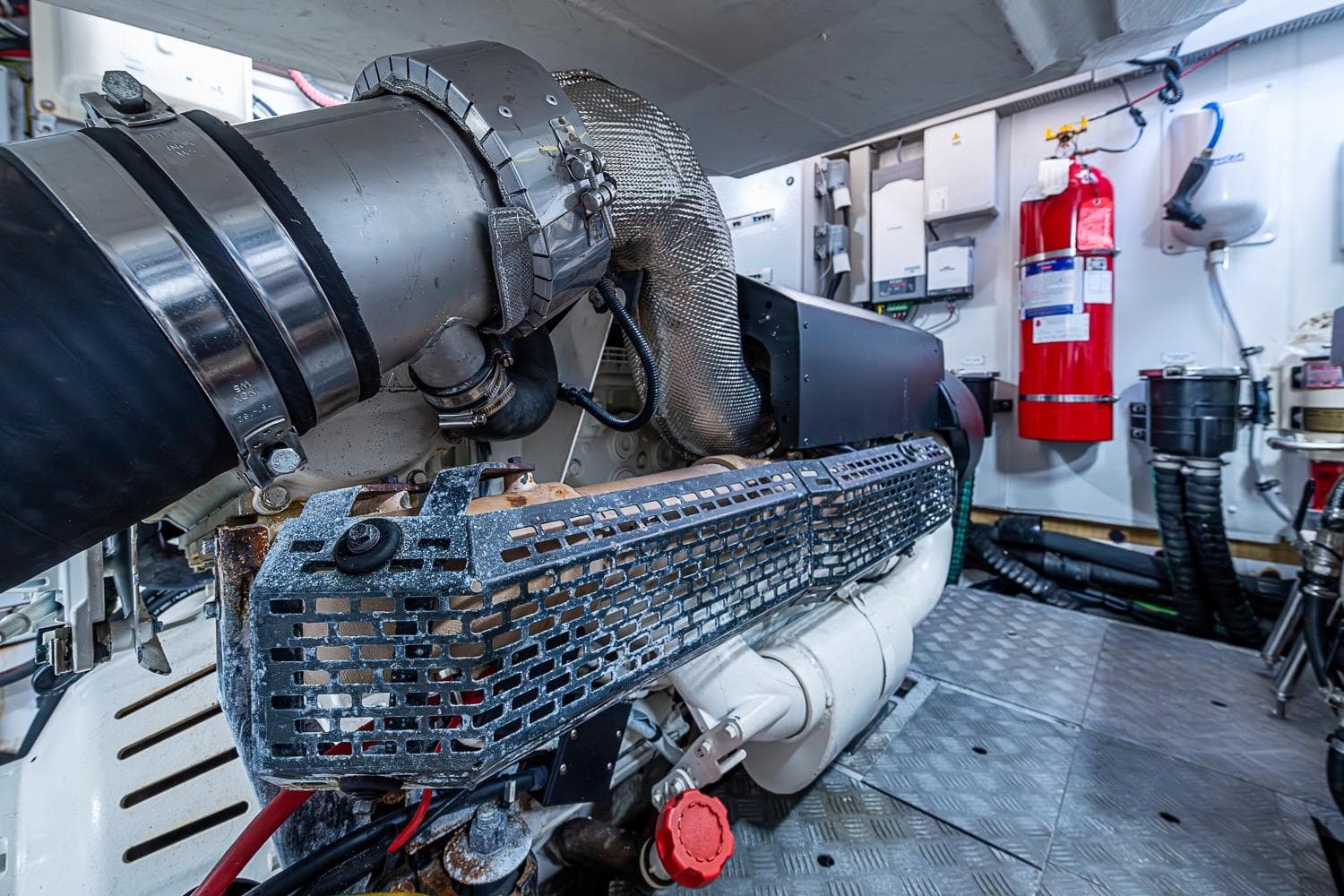 Engine room of 2019 Azimut Atlantis 51 yacht, featuring advanced machinery and safety equipment.