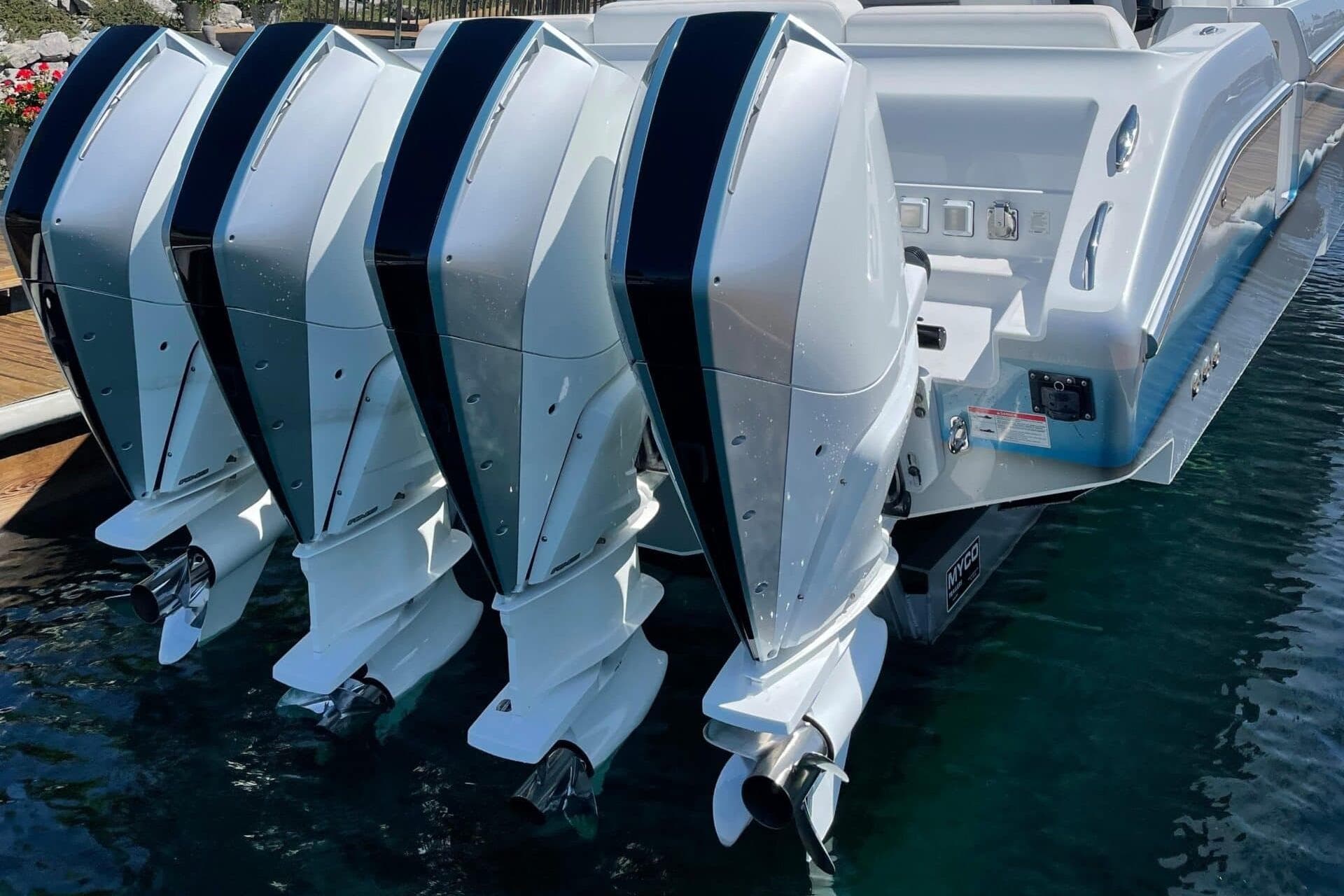 2019 Cigarette 41' GTR boat with four powerful outboard engines.