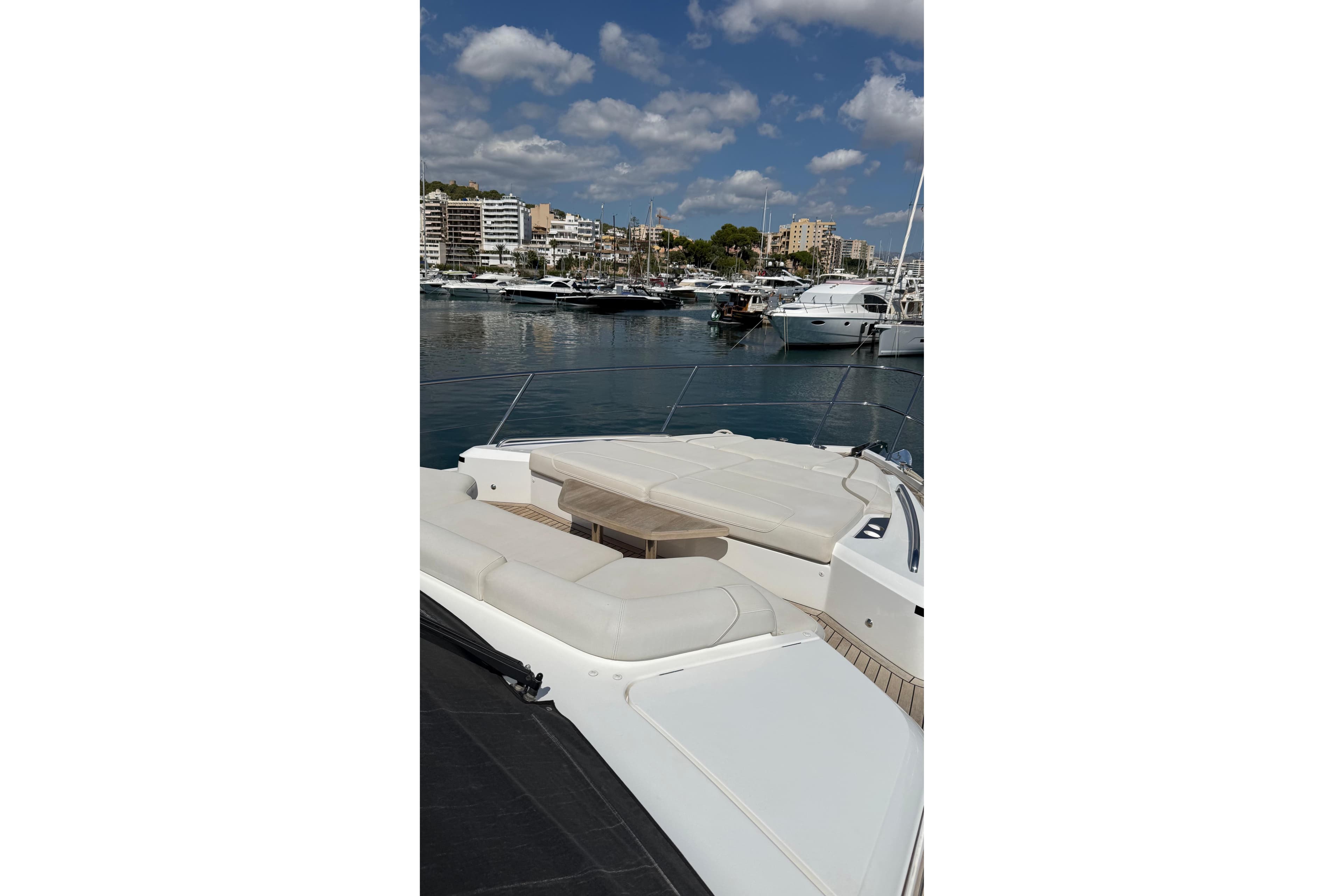 Luxury Princess S62 yacht docked in marina, 2021 model, with cityscape background.