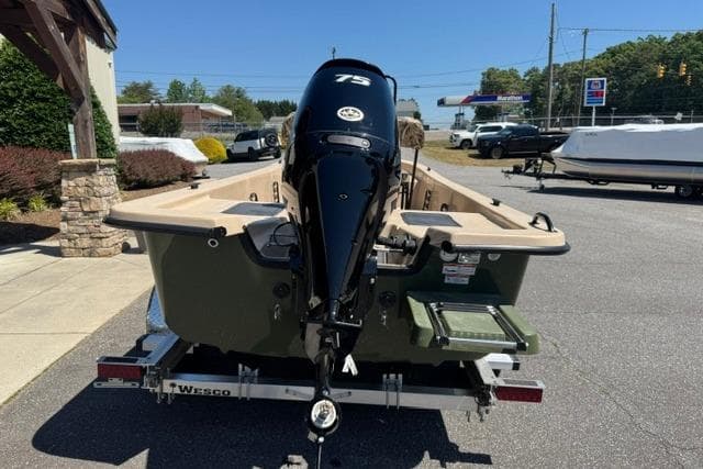 2026 Carolina Skiff E18 JVX CC boat on trailer, featuring a 75 HP outboard motor.