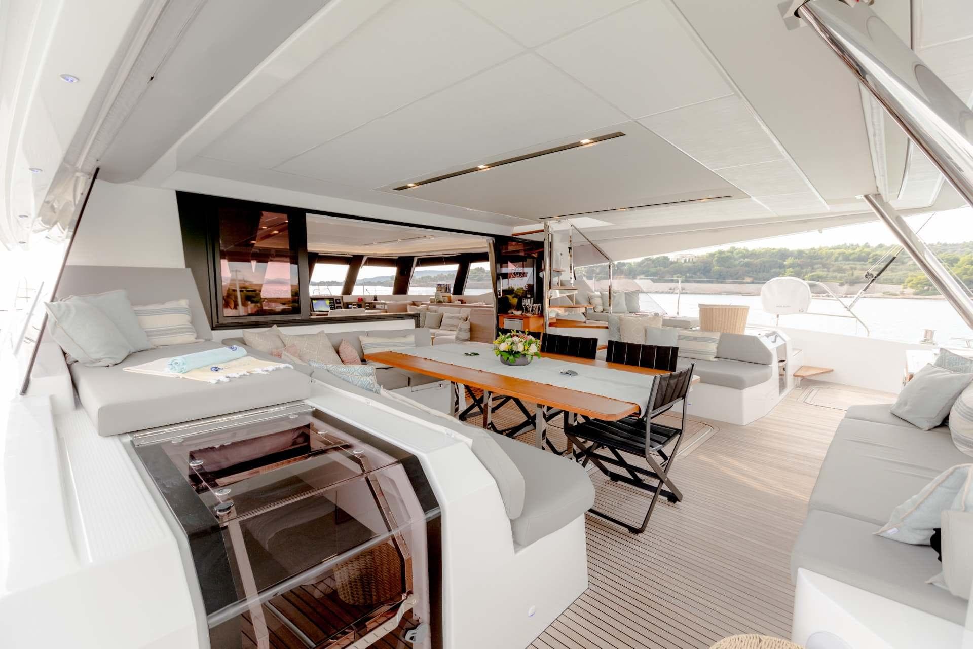 Luxurious 2025 Fountaine Pajot Samana 59 yacht interior with spacious seating and elegant design.