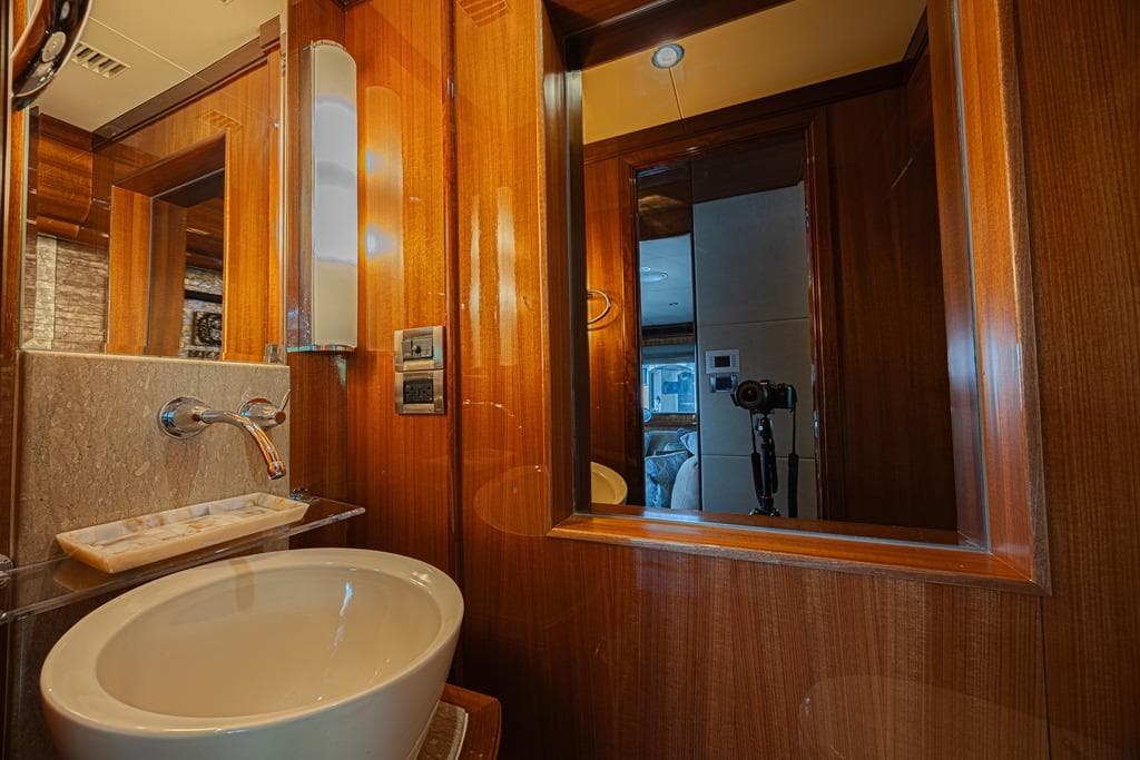 Luxurious bathroom interior of 2010 Ocean Alexander 74 Motoryacht with elegant wood finish.