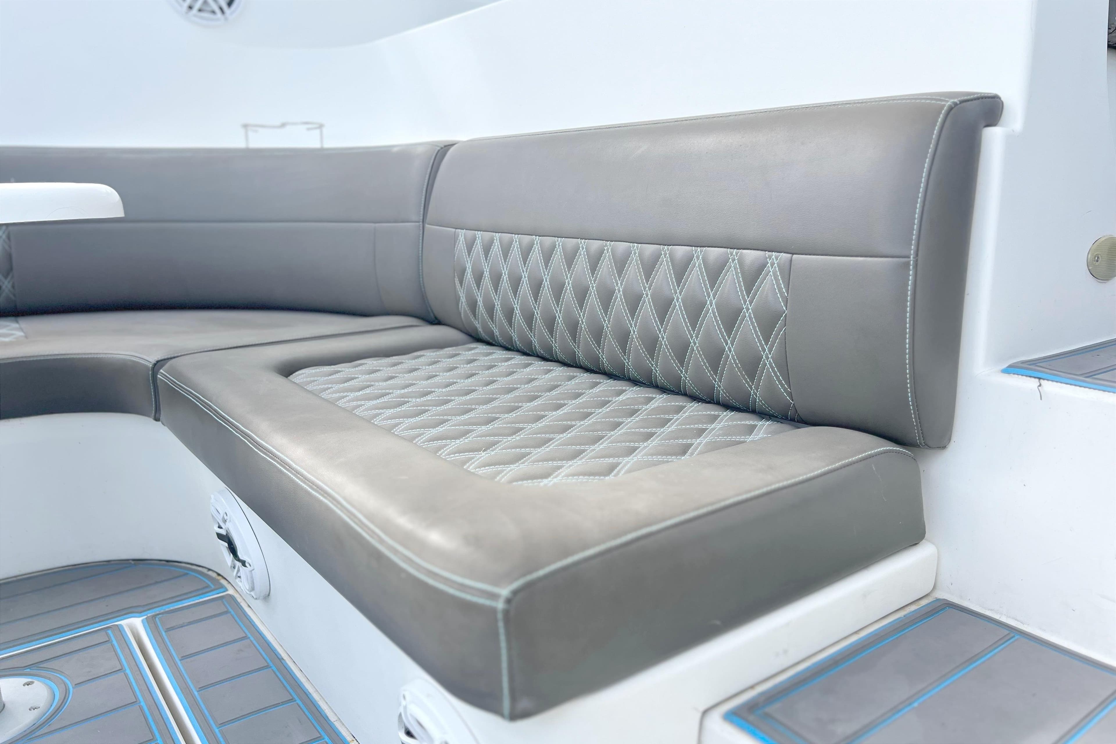 Luxury seating on 2005 Cruisers Yachts 440 Express with diamond-stitched upholstery.