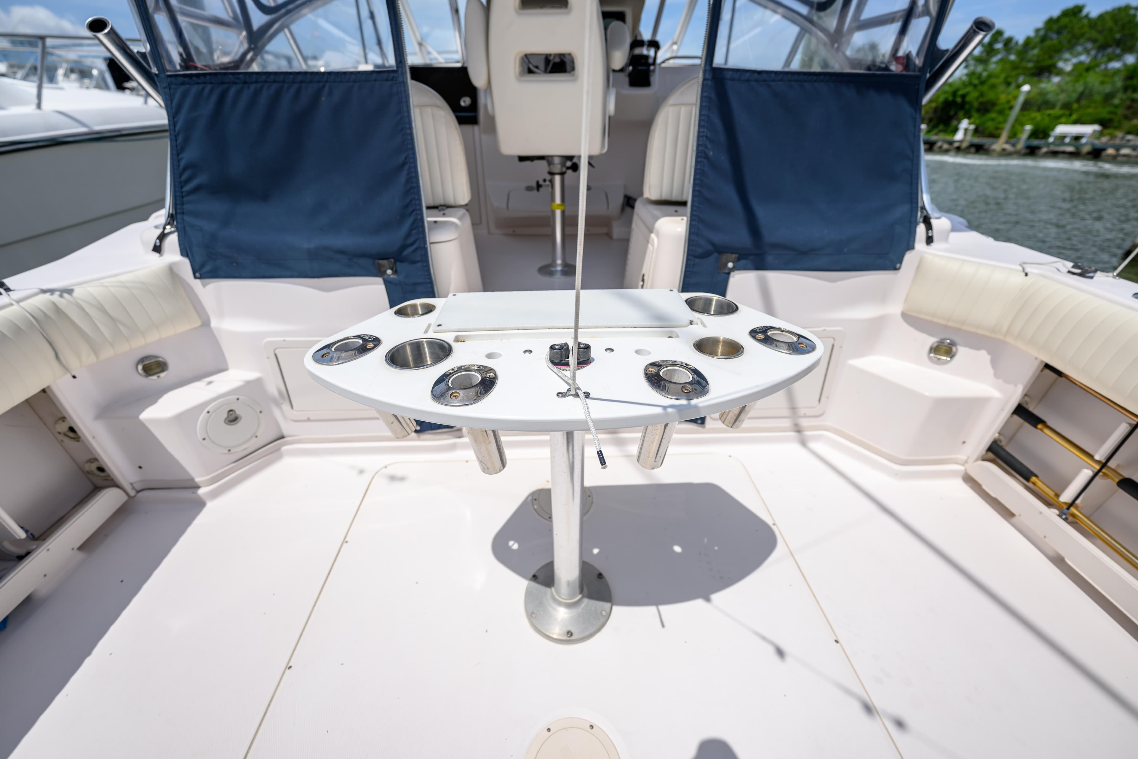2003 Grady-White Express 330 boat interior with fishing rod holders and seating.