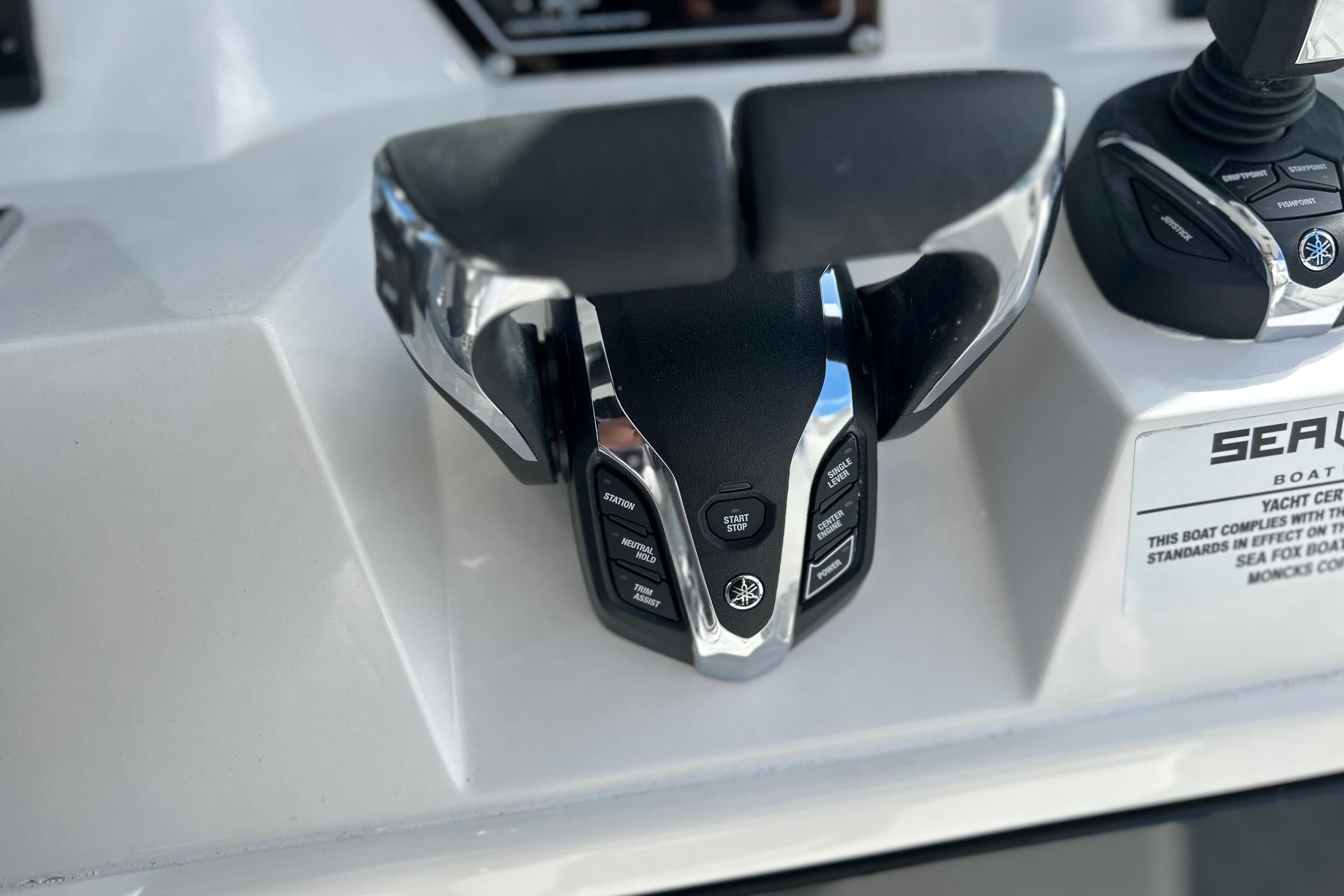2026 Sea Fox 368 Commander boat controls with modern throttle and joystick.