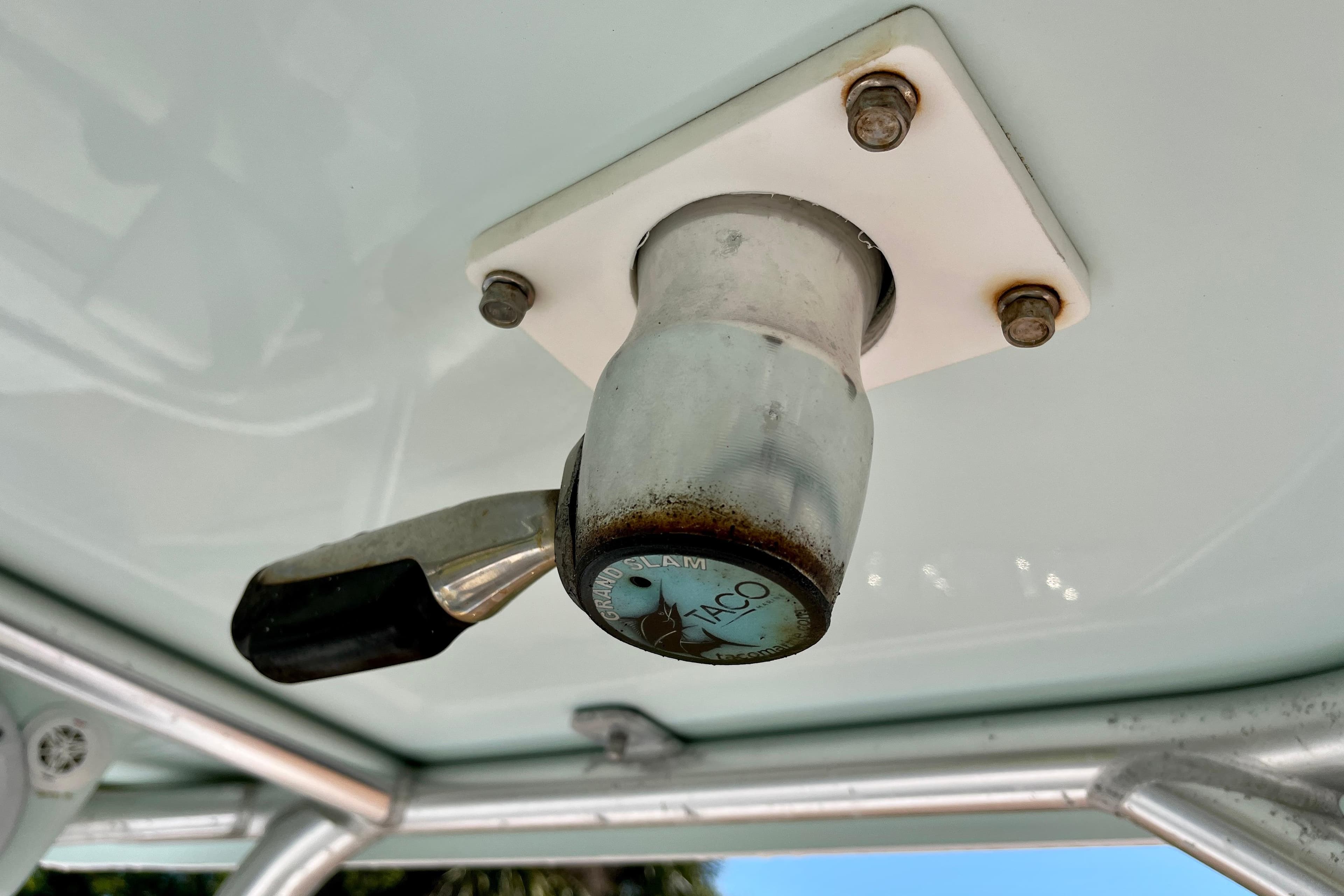 Close-up of a 2018 Pro-Line 26 Express boat's T-top mount with a Taco Grand Slam handle.
