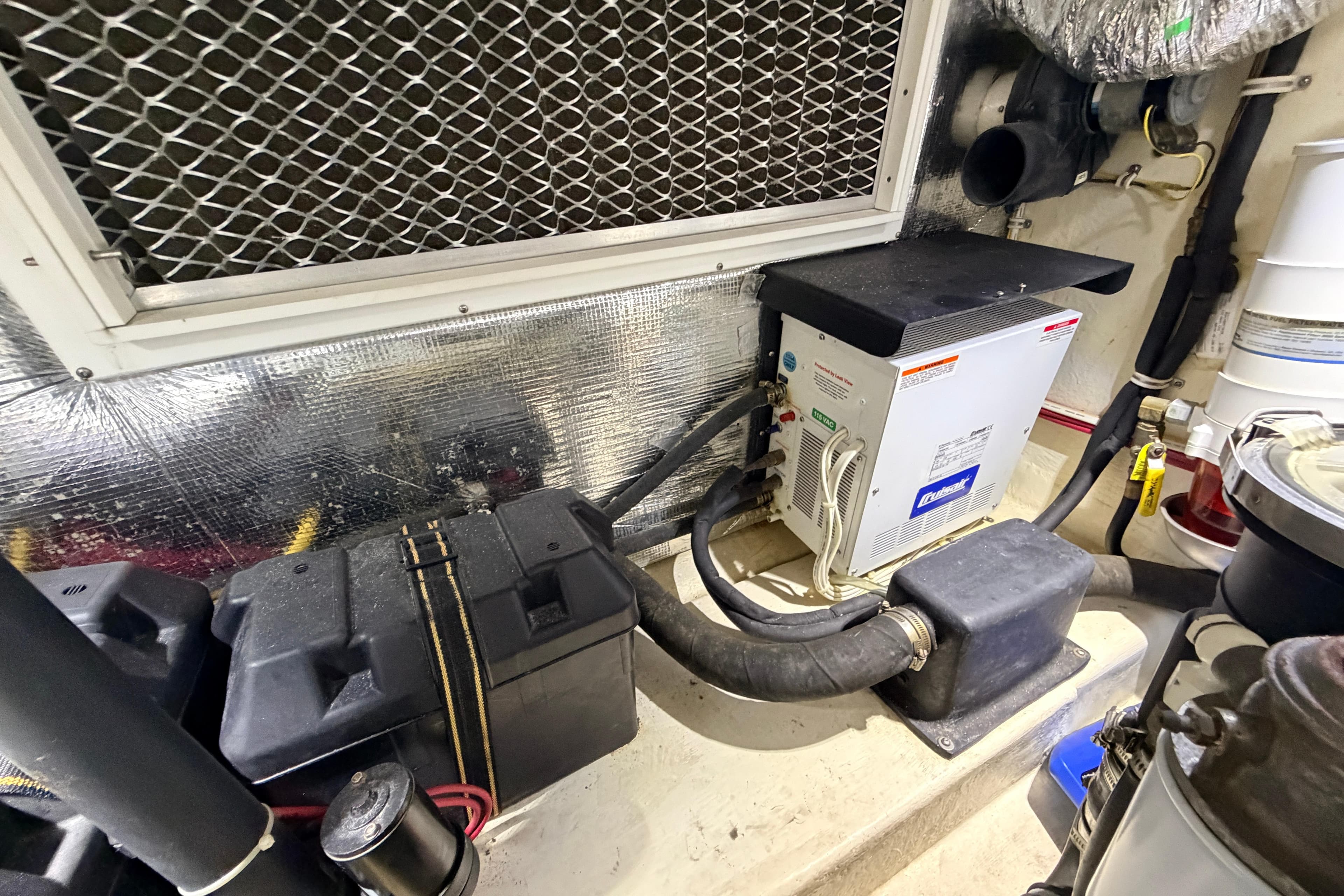 Engine room of 2015 Albemarle 360 Express Fisherman with equipment and wiring.