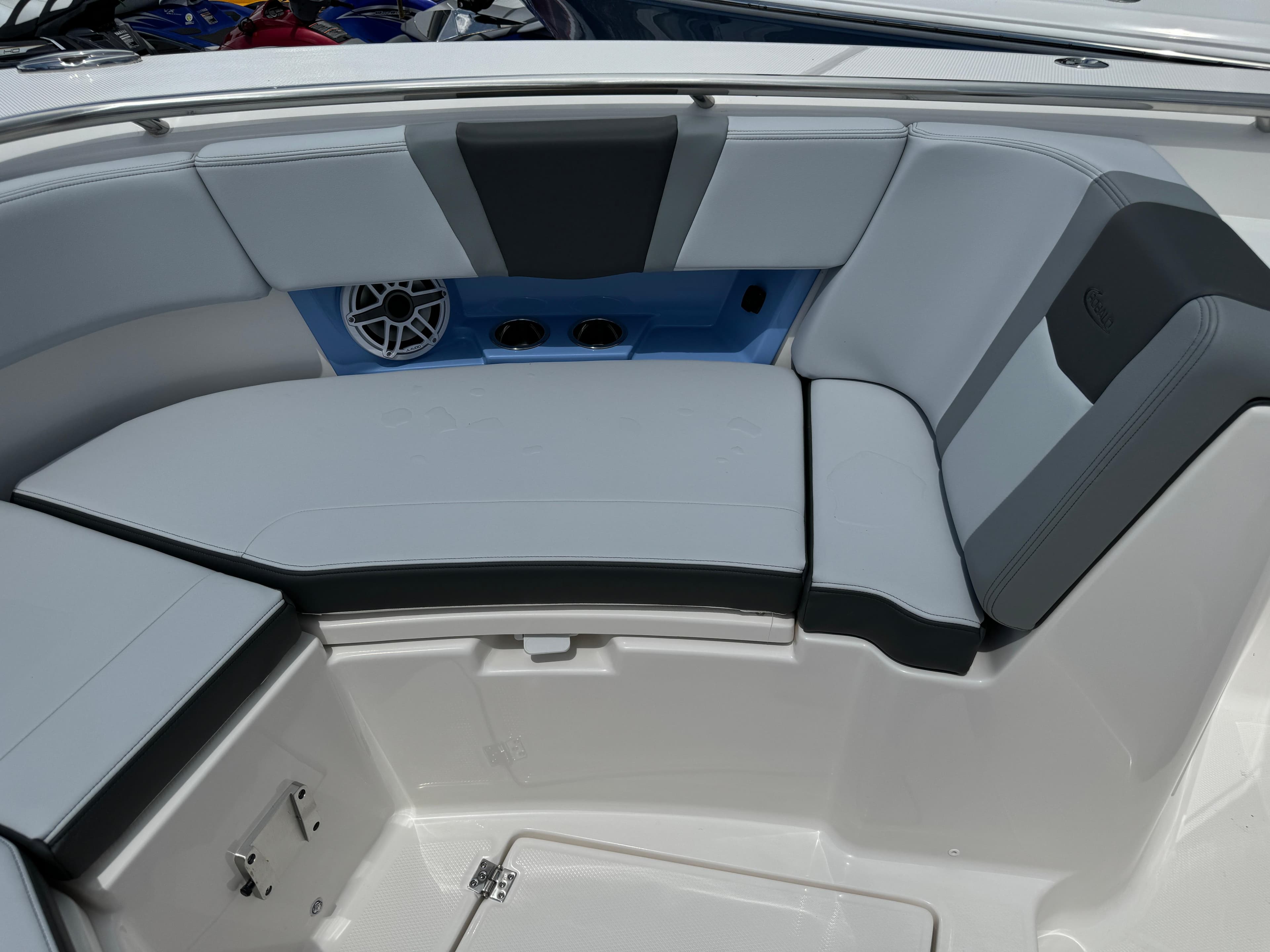 2025 Robalo R360 Center Console boat interior with cushioned seating and speaker system.