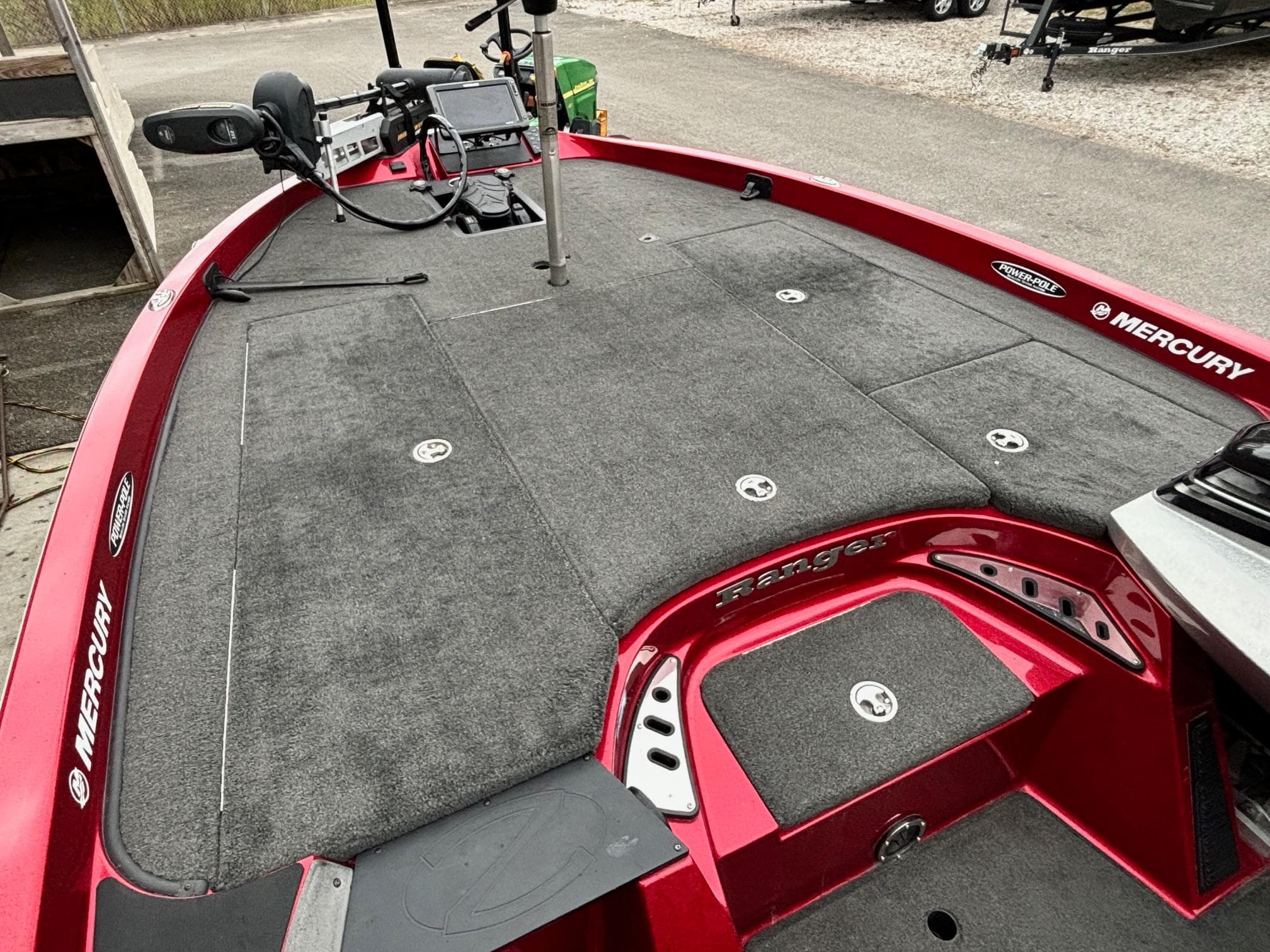 2016 Ranger Z520 boat deck with Mercury branding, featuring fishing equipment and controls.
