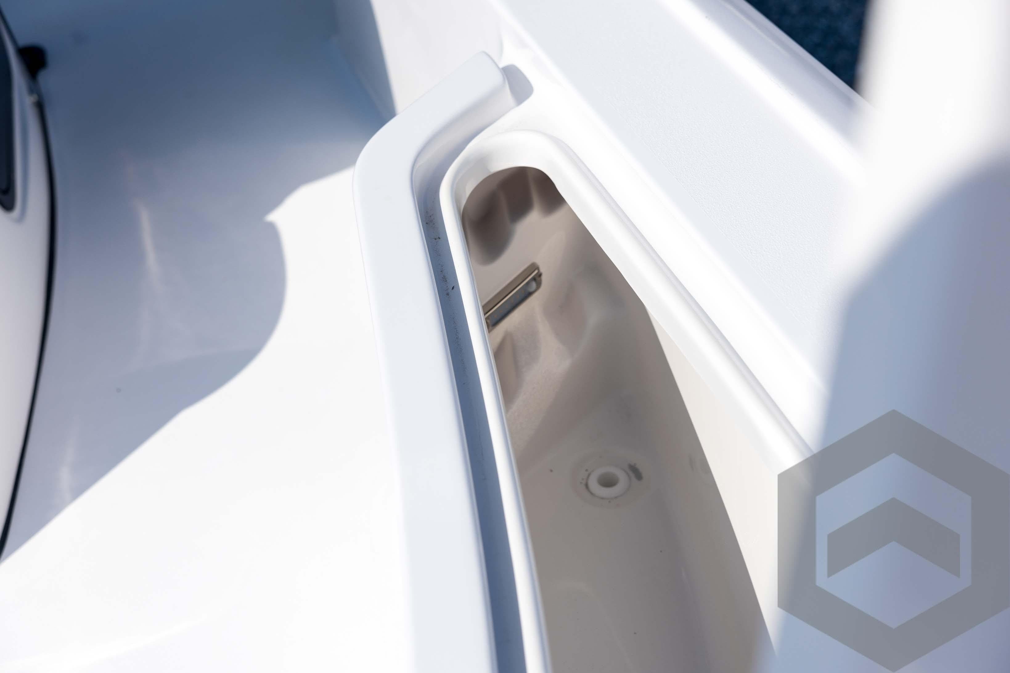2026 Tidewater 2410 Bay Max boat interior detail, showcasing storage compartment.
