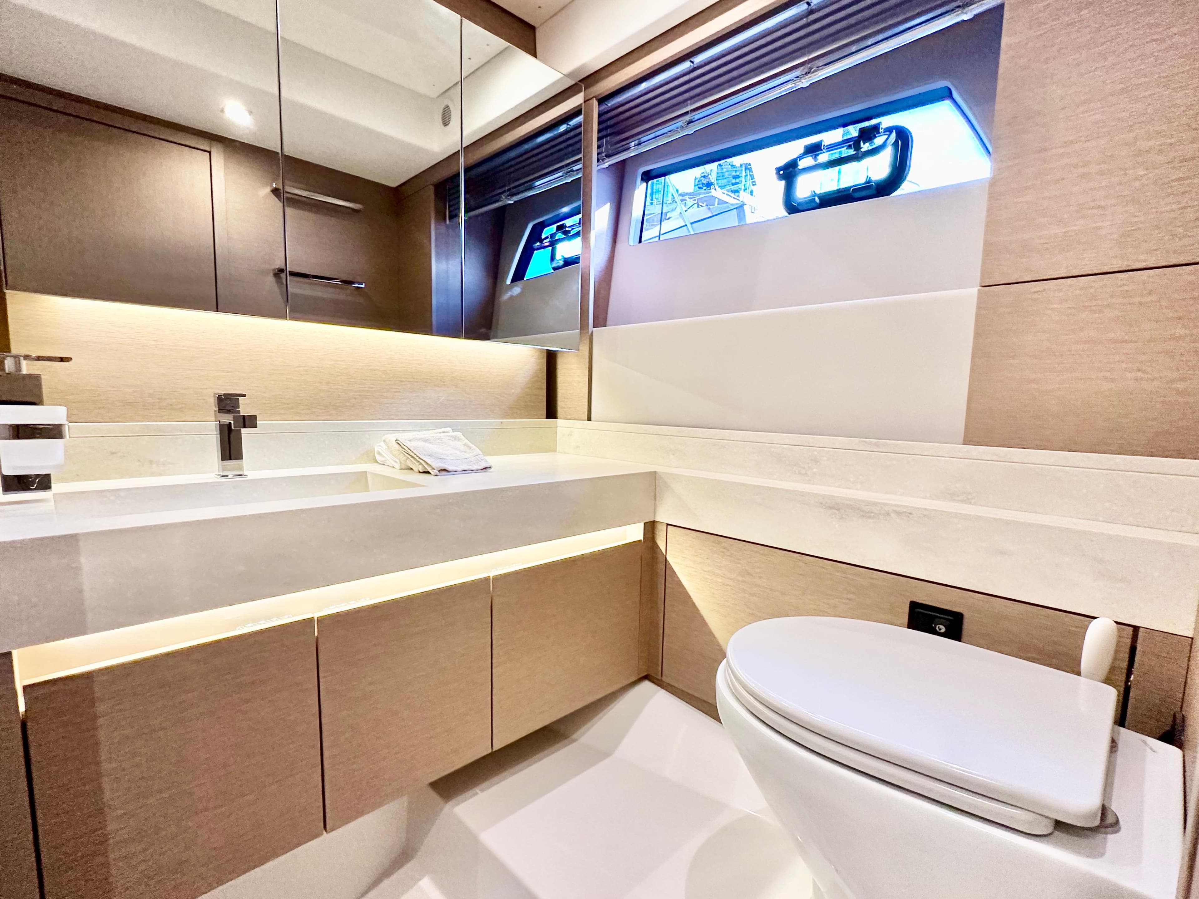 Luxurious bathroom interior on a 2023 Prestige 520 yacht, featuring modern fixtures and elegant design.