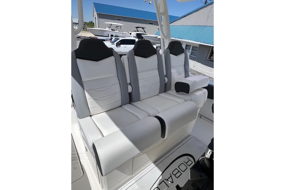 2026 Robalo R300 Center Console boat seating, featuring sleek white and black cushioned design.