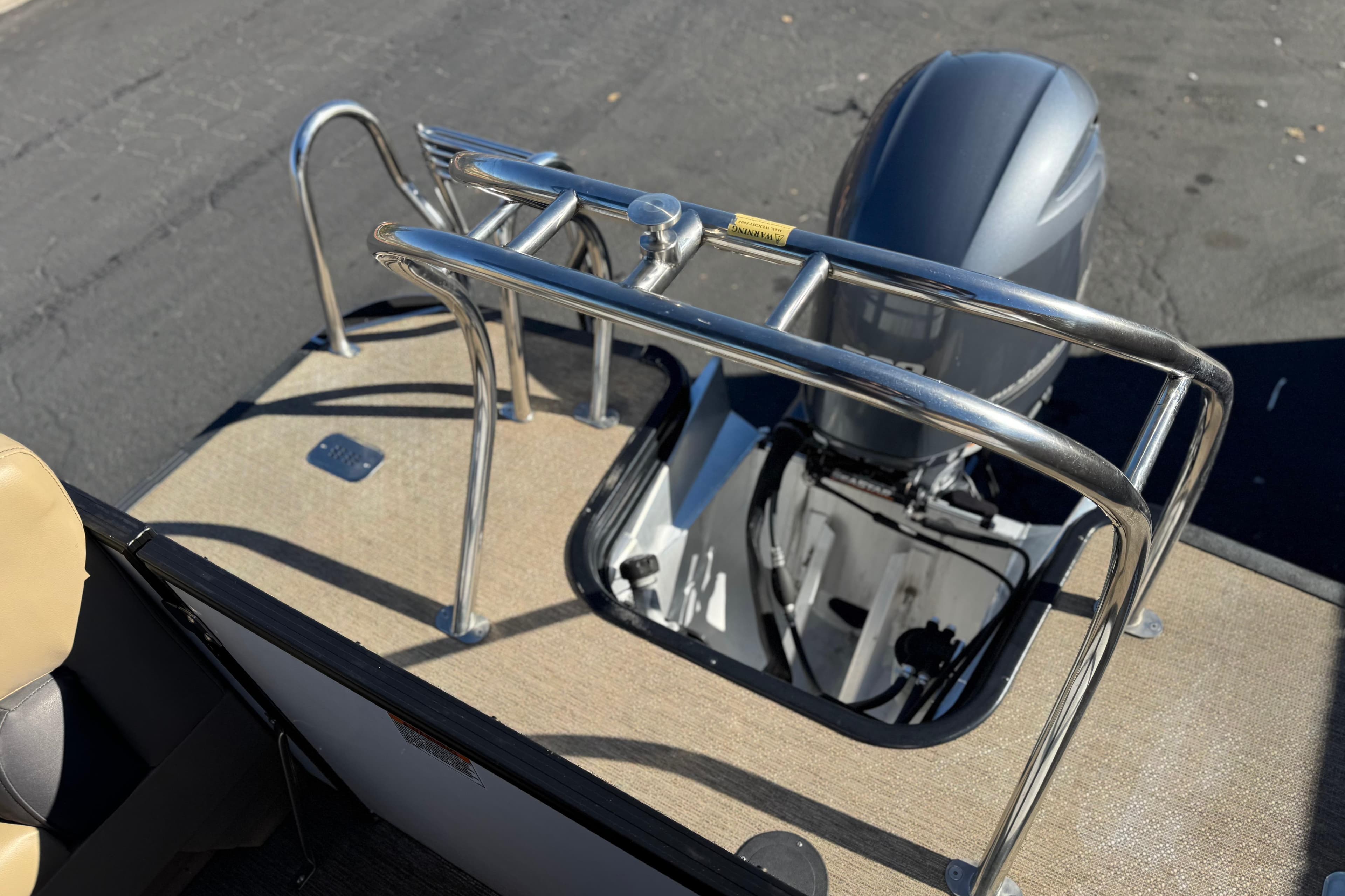 2021 Starcraft SLS 3 boat with outboard motor and stainless steel railing.