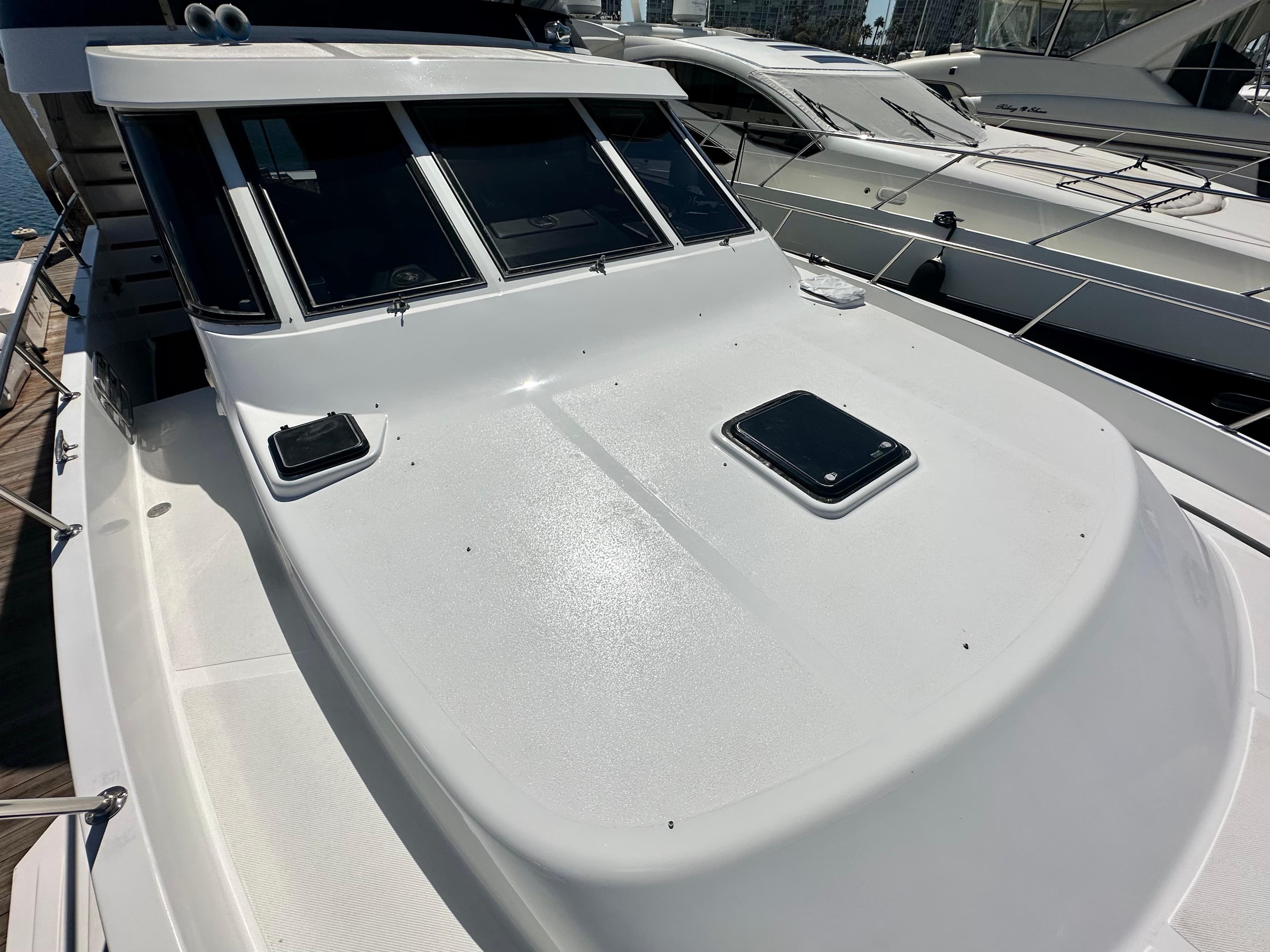 1993 Tollycraft 57 Pilothouse on a dock, front deck view.