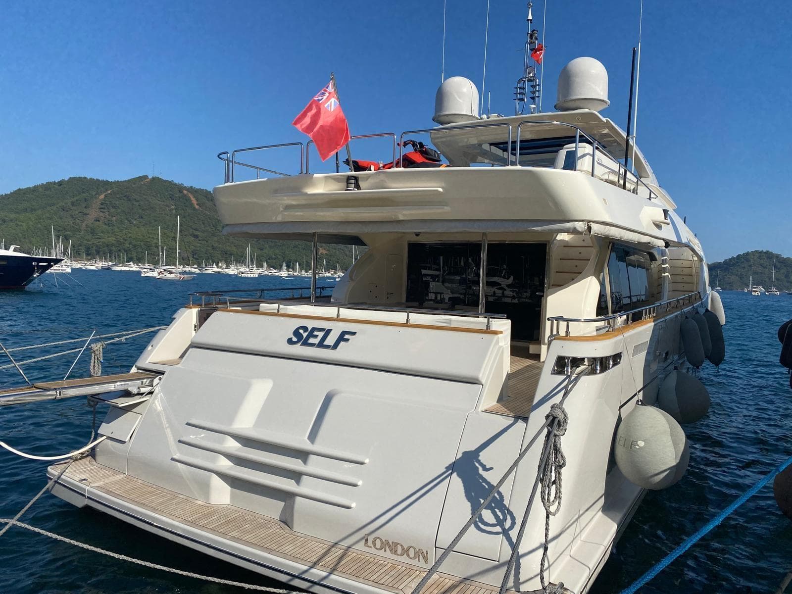 Luxury 2011 Ferretti Yachts Custom Line 100 docked, featuring sleek design and spacious deck.