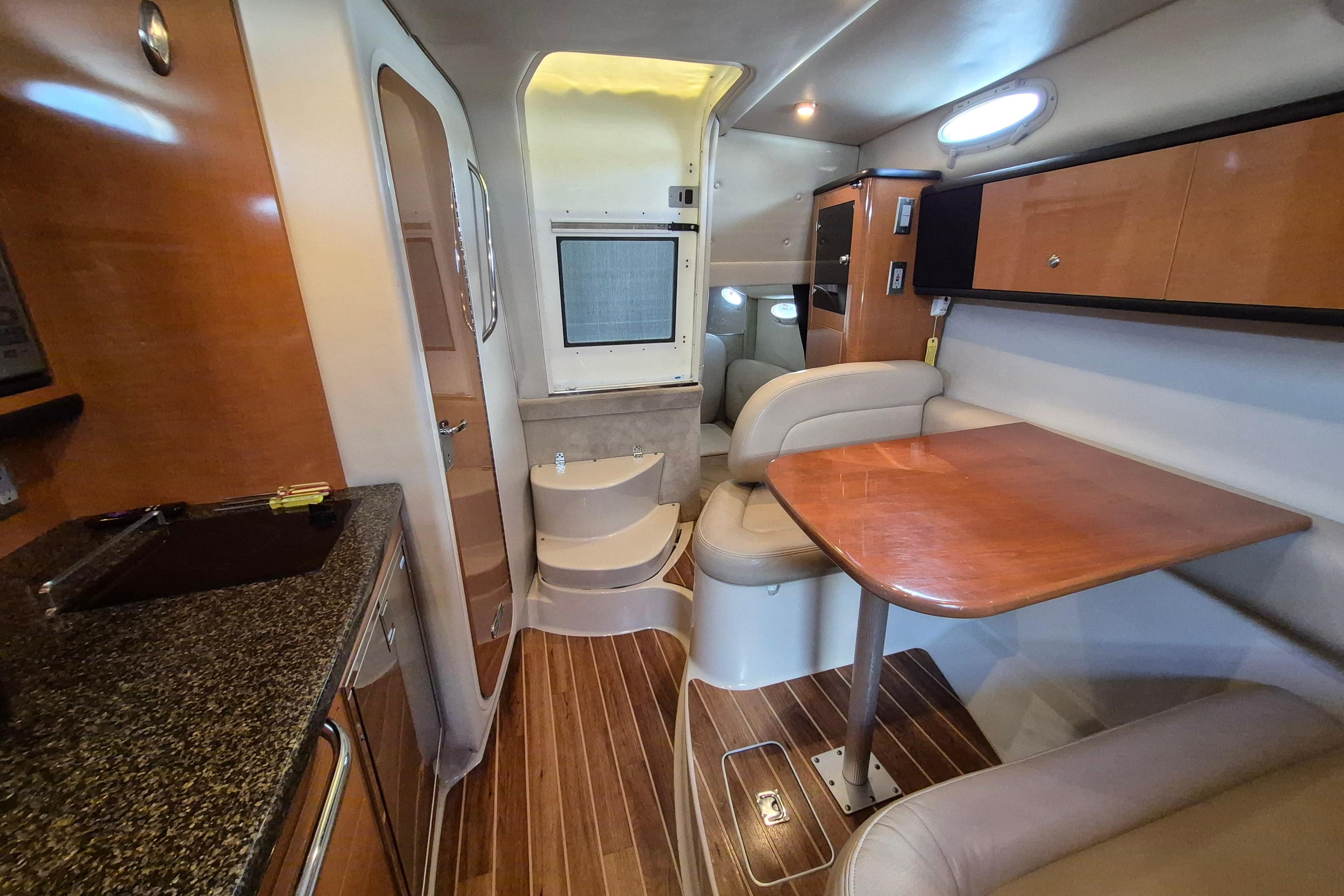 2008 Chaparral Signature 280 interior with wood accents, dining area, and modern amenities.