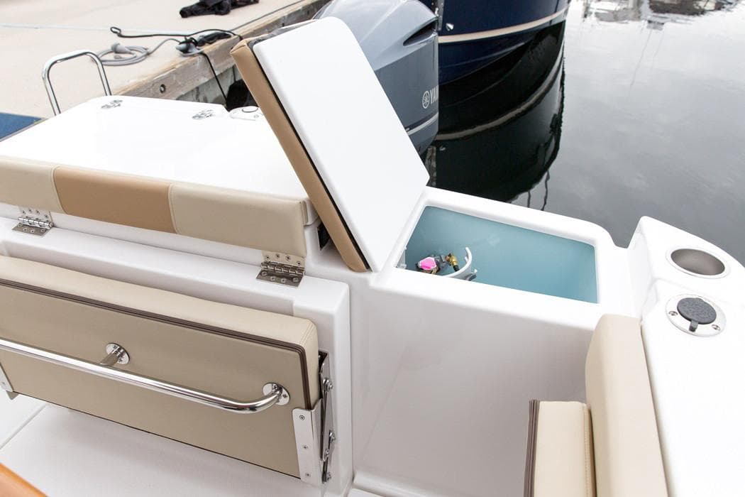Manufacturer Provided Image: 2022 Ranger Tugs R-27 boat with open storage compartment and seating area.