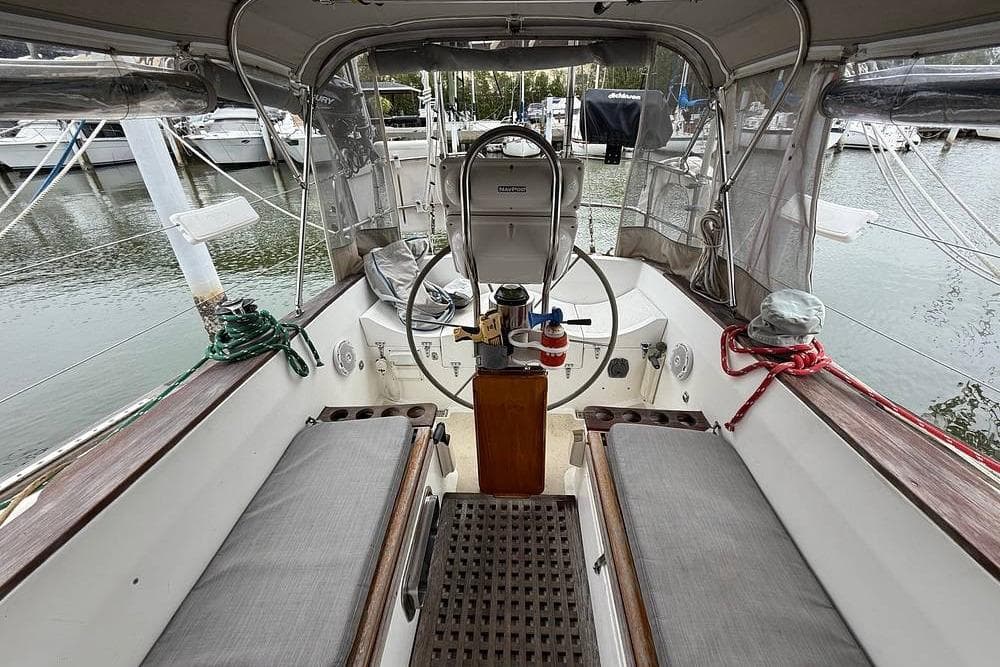 Cockpit of a 1984 Morgan 384 sailboat docked at a marina.