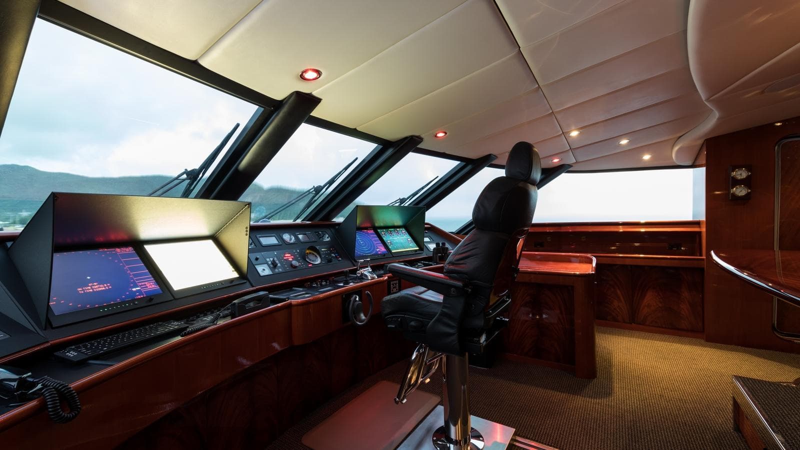 Luxurious yacht helm with advanced navigation systems, Custom Louisbourg 2004 model.