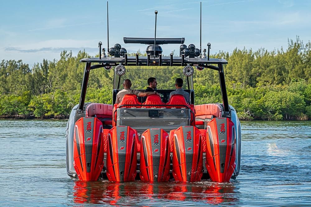 2021 Midnight Express 43 Solstice boat with multiple engines on a serene waterway.