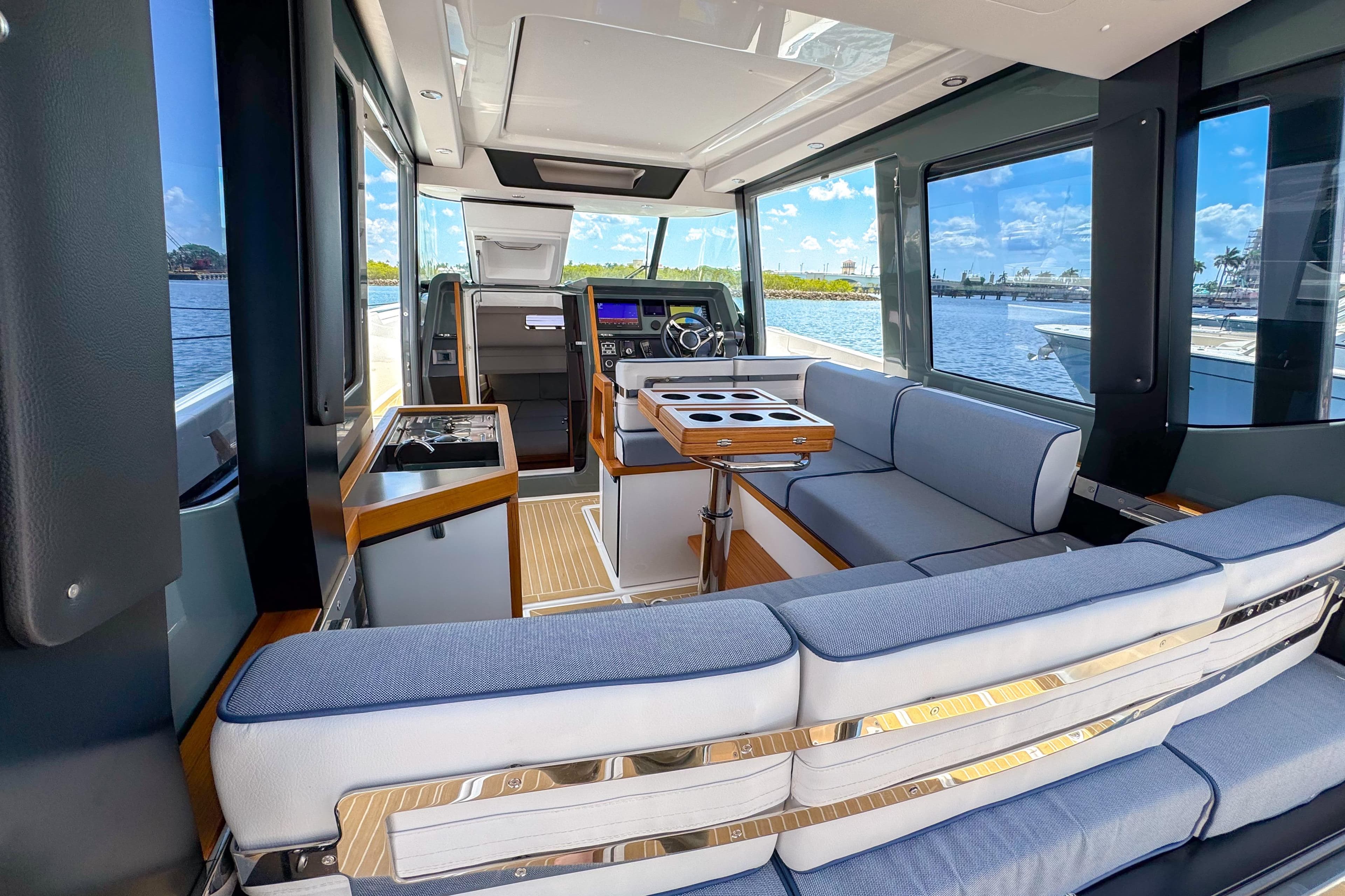 Luxurious interior of 2025 Aiata Wayfinder 38 Cabin yacht with modern seating and navigation controls.