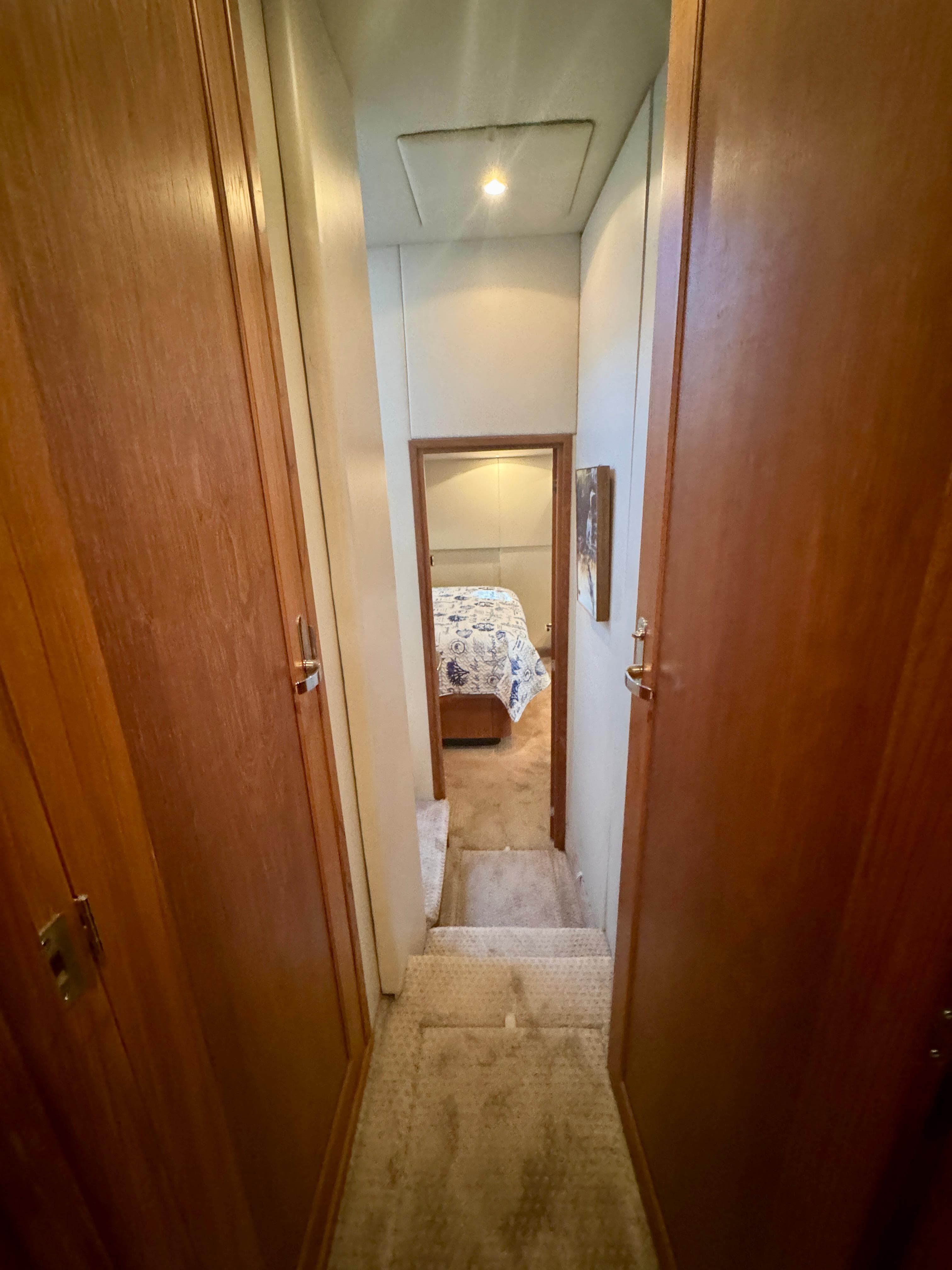 Hallway leading to bedroom in 1999 Bayliner 5288 Pilot House Motoryacht.