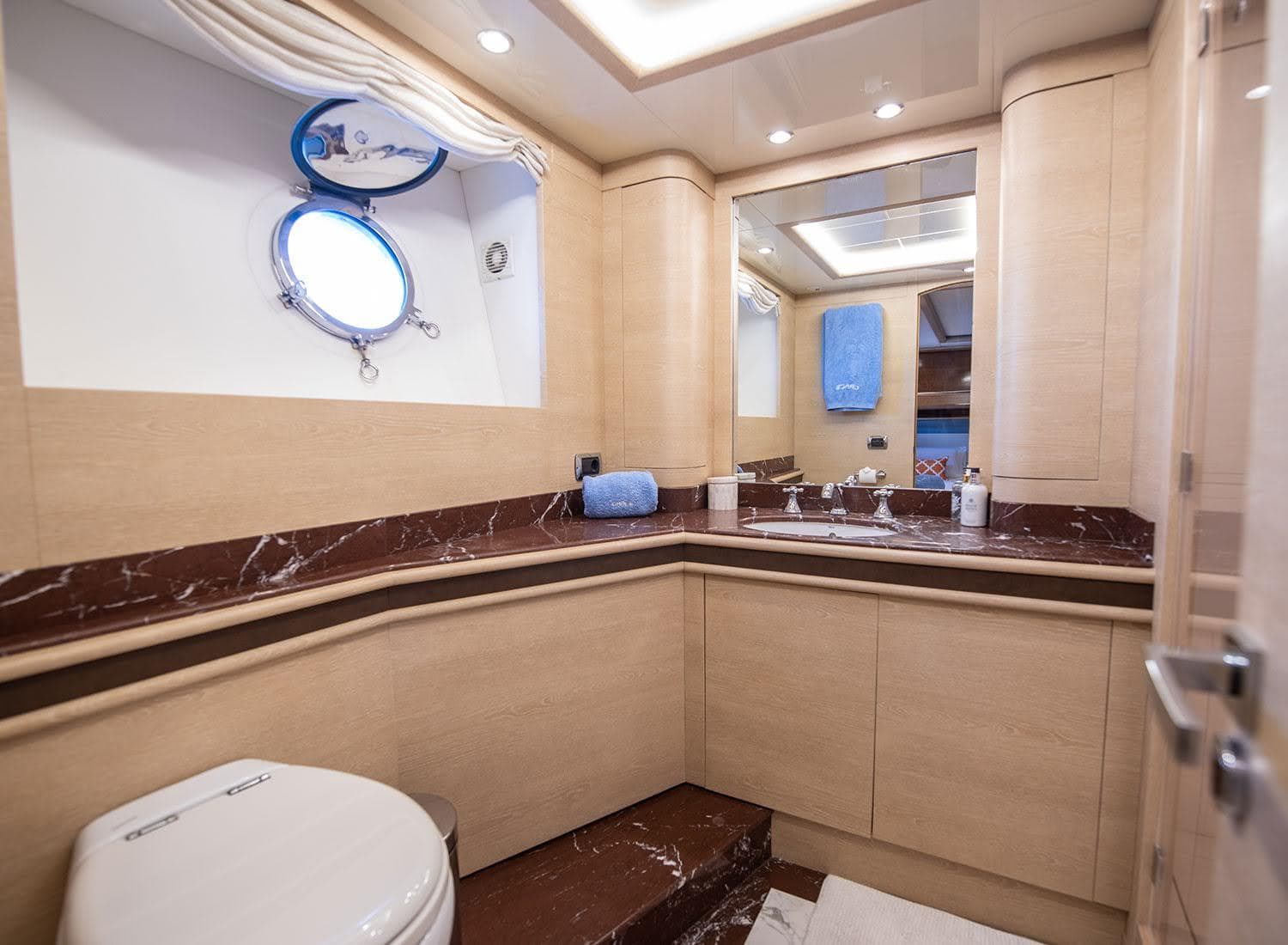 Luxurious bathroom in 2009 Astondoa 96 GLX yacht with marble accents and modern fixtures.