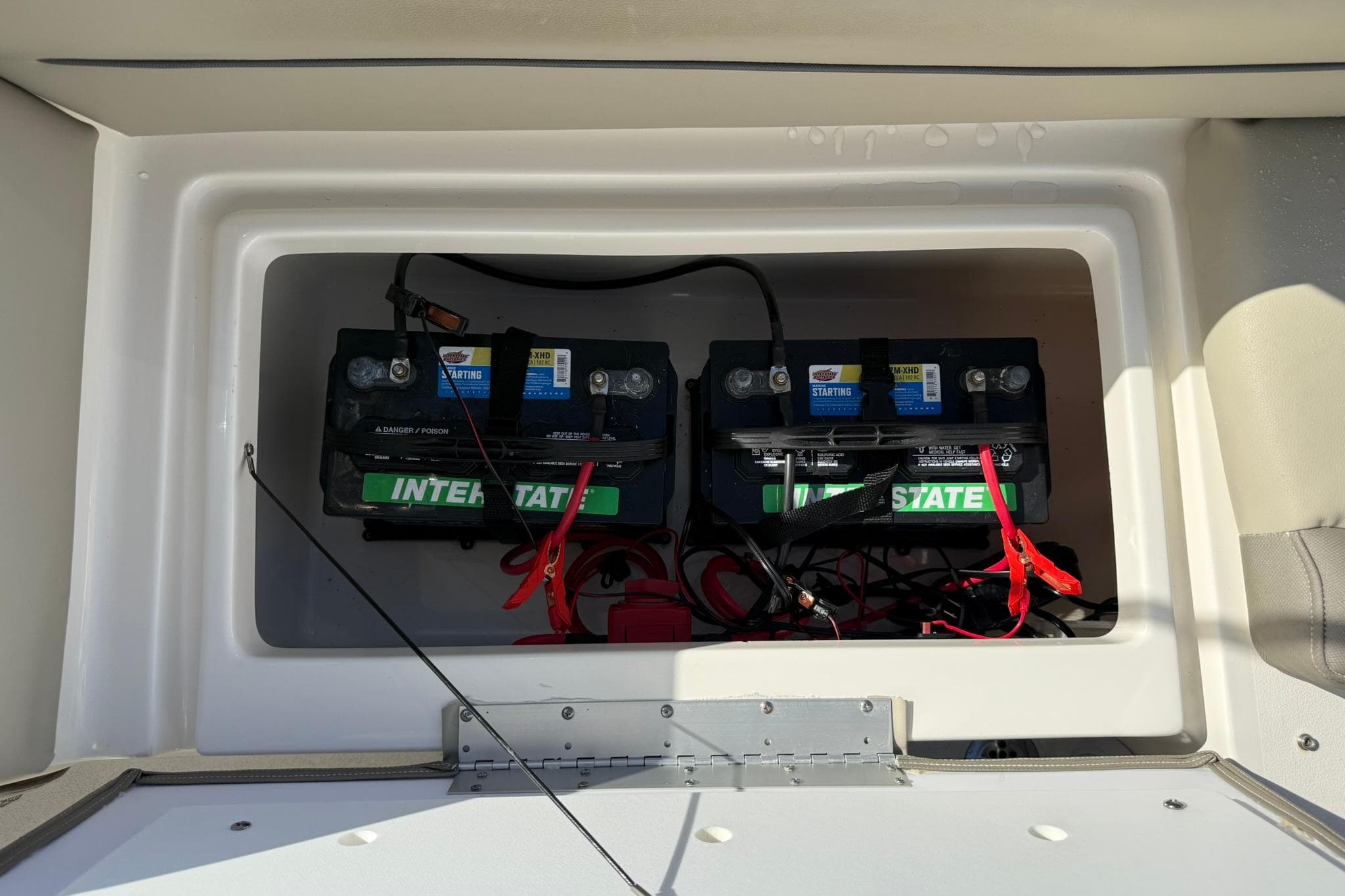 2023 Key West 239 DFS boat battery compartment with dual Interstate batteries.