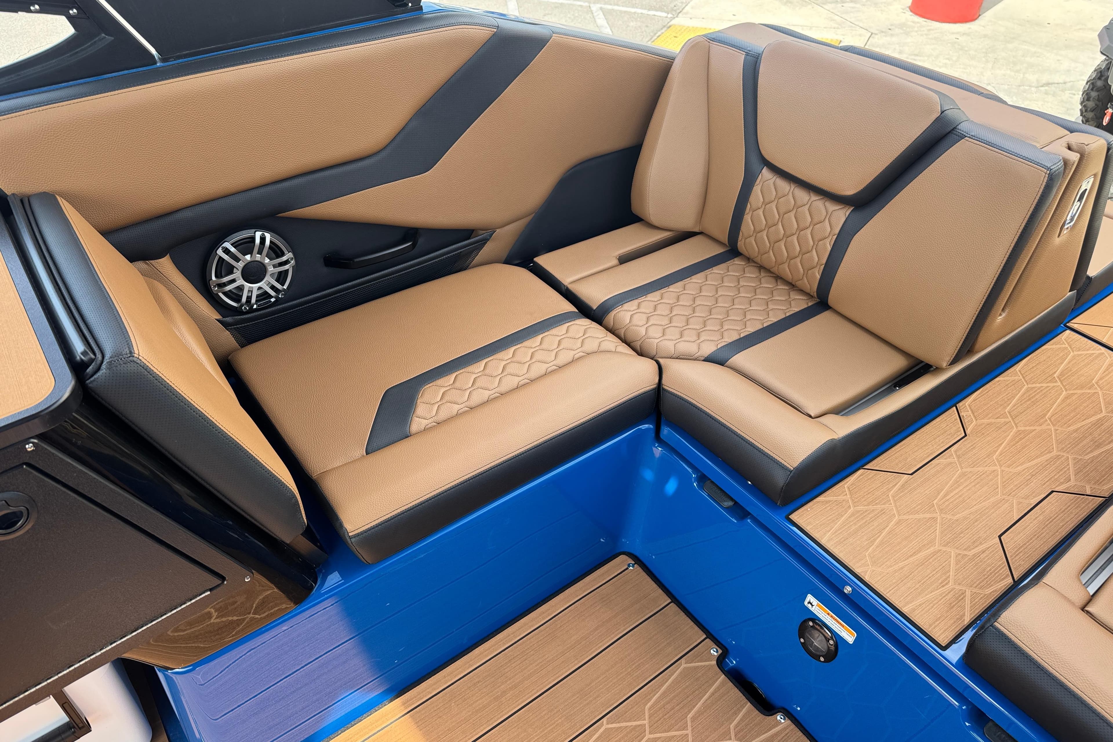 Luxurious interior seating of 2026 Yamaha Boats 255XD with tan and black upholstery.