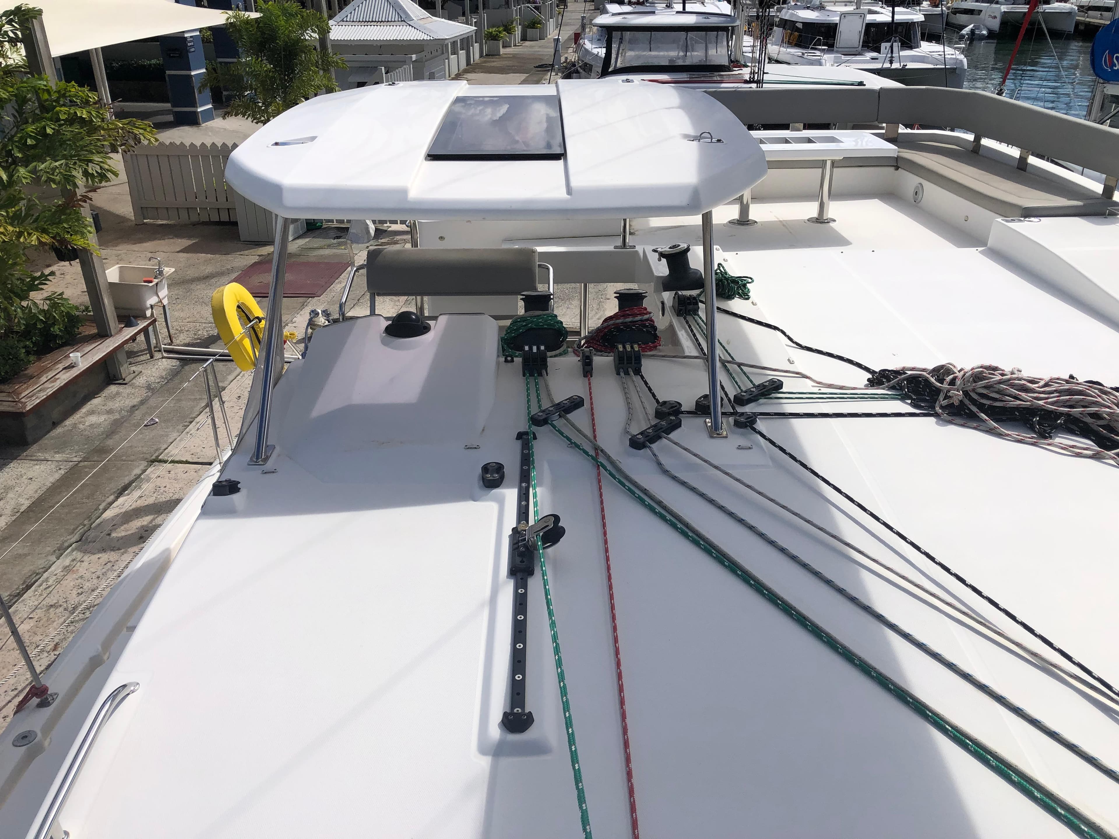 Leopard 50 catamaran deck with ropes and equipment, docked at marina, 2020 model.