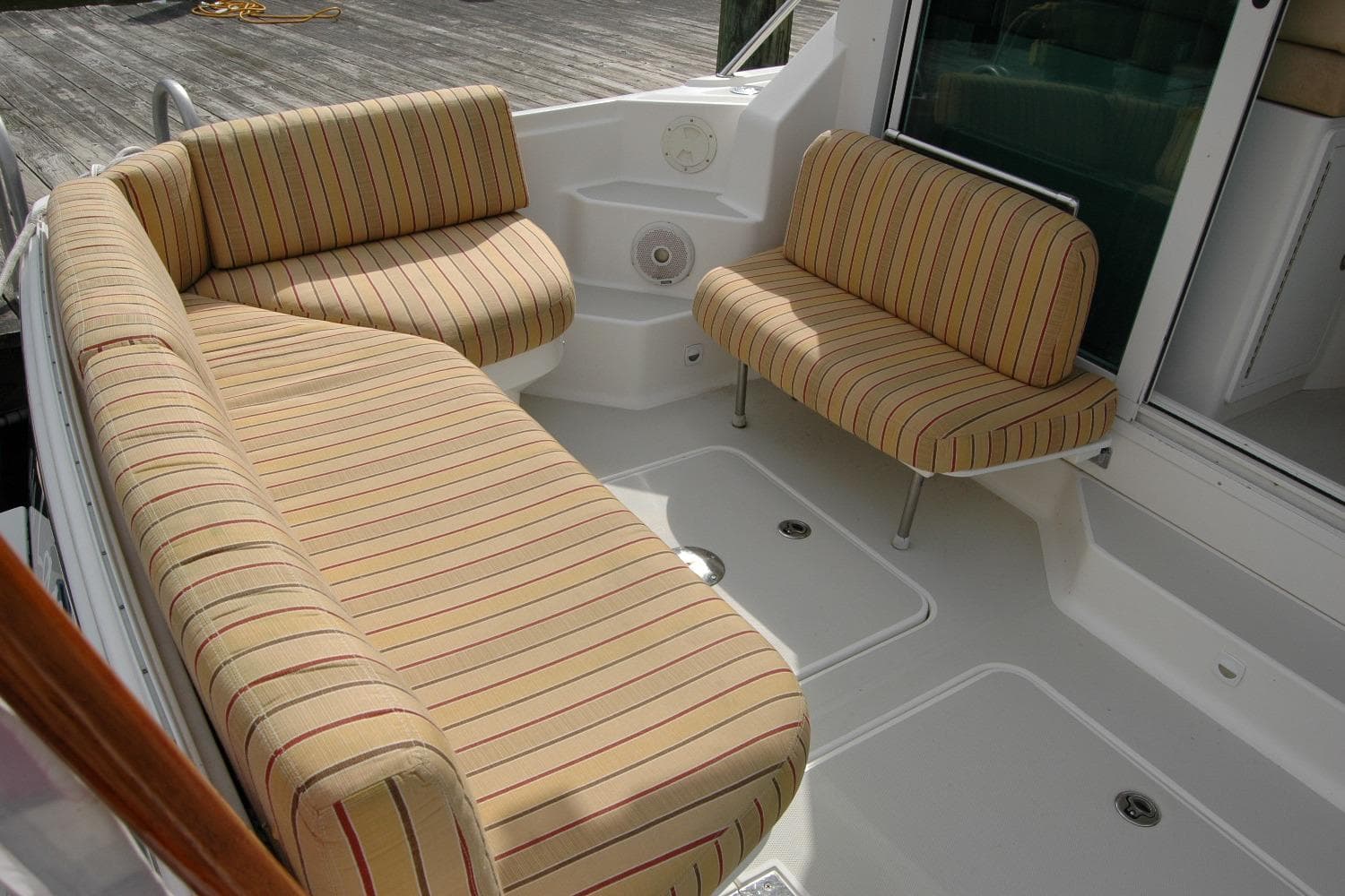 2014 Back Cove 34 boat with striped seating in the cockpit area.