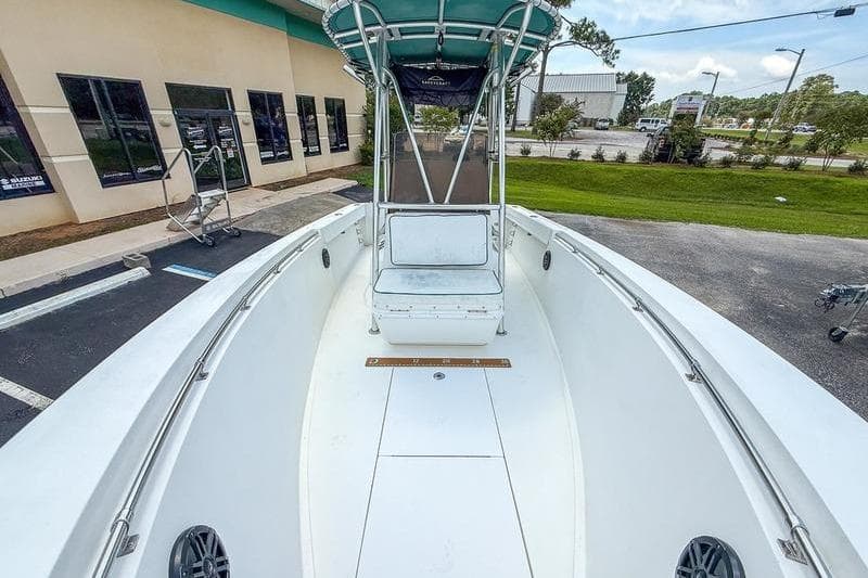 1997 Contender 21 Open boat with center console and T-top, parked outdoors.