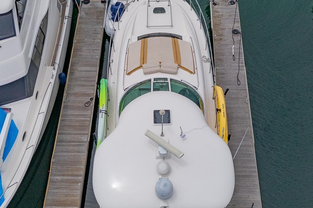 Overhead view of a 2005 Sea Ray 390 Motor Yacht docked with kayaks.