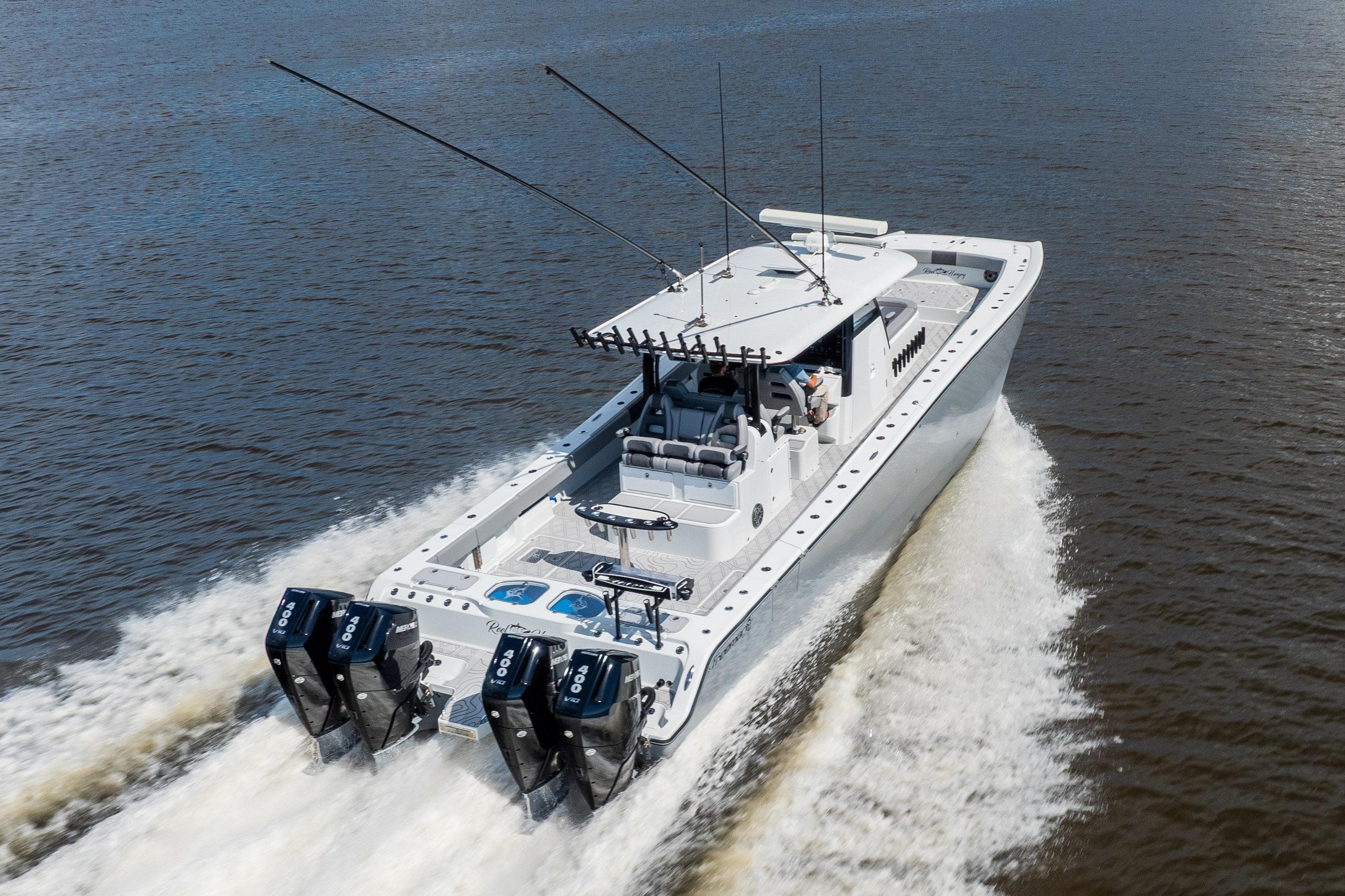 2023 Freeman 47 boat cruising on water, showcasing powerful engines and sleek design.