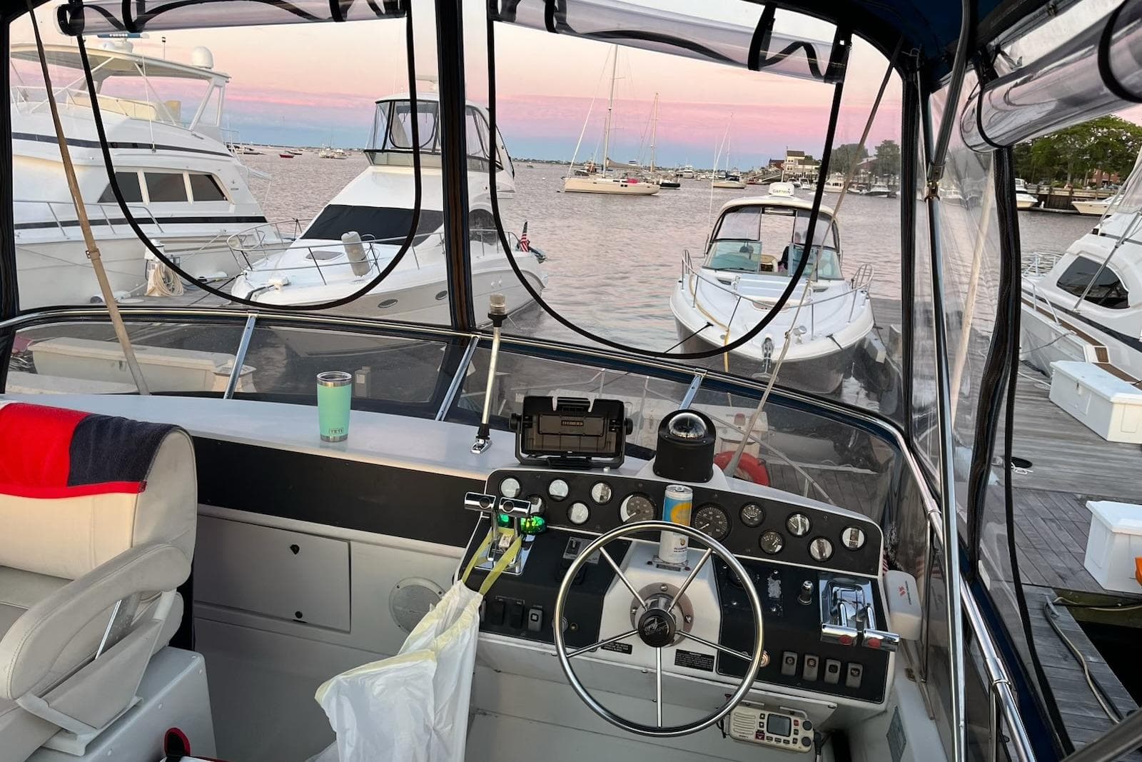 Cockpit view of a 1993 Carver 30 Santego yacht docked at a marina.