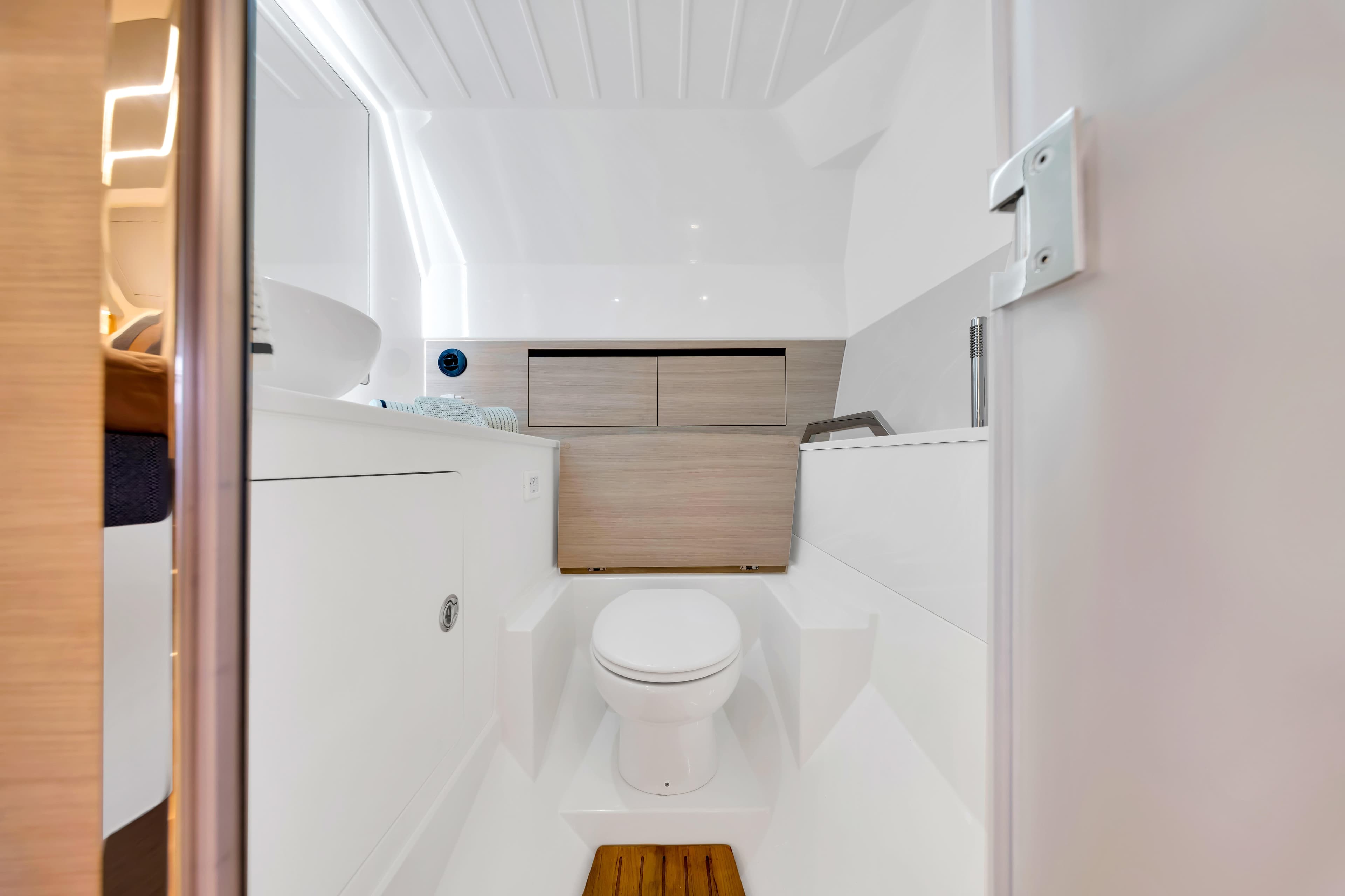 Modern bathroom interior on 2026 Aquila 45 Sport yacht, featuring sleek design and wooden accents.
