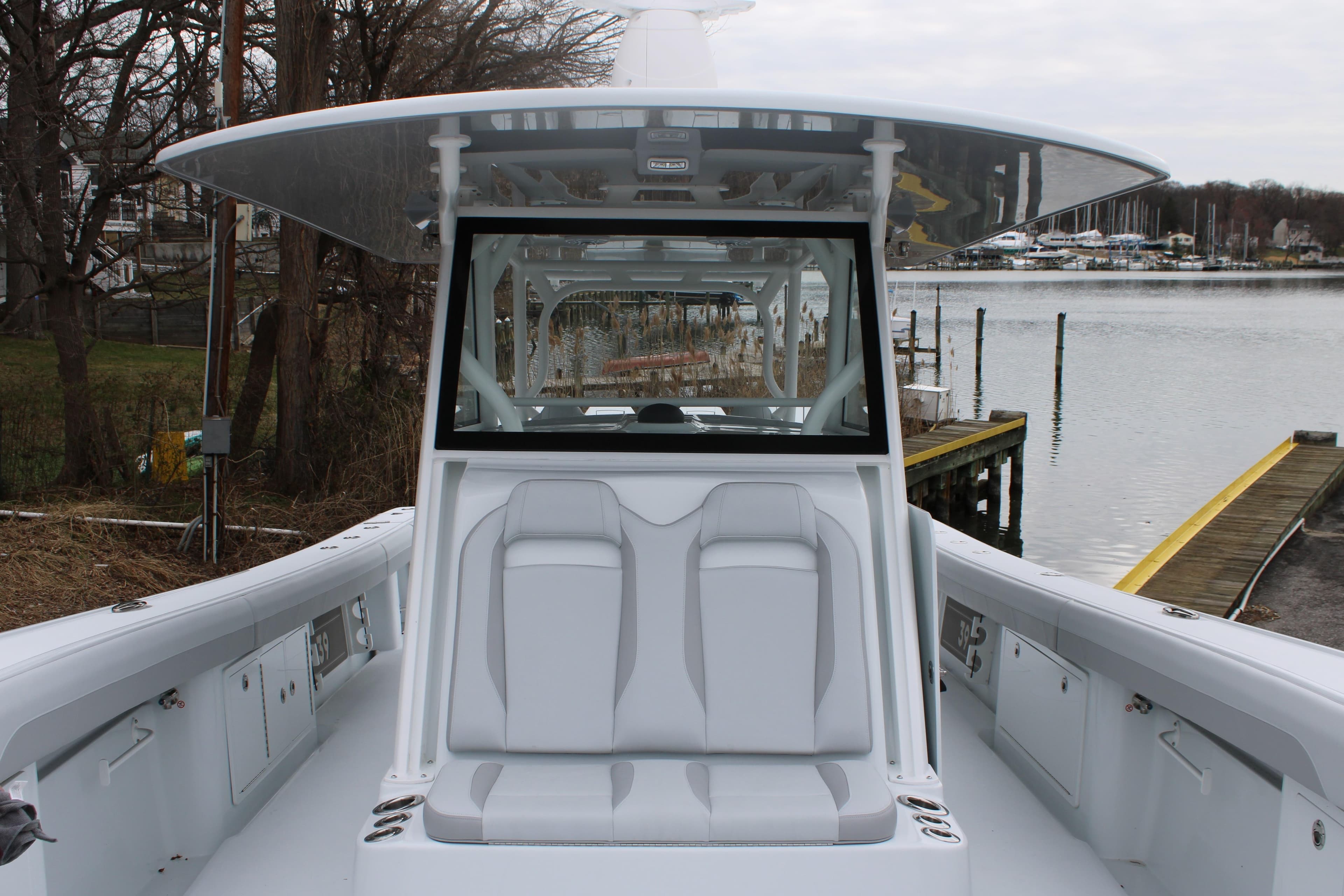 2026 Yellowfin 39 Offshore boat with sleek seating and modern design by the water.