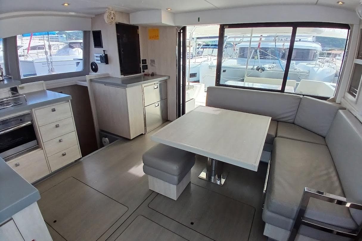 Interior of 2020 Leopard 40 catamaran with modern kitchen and dining area.