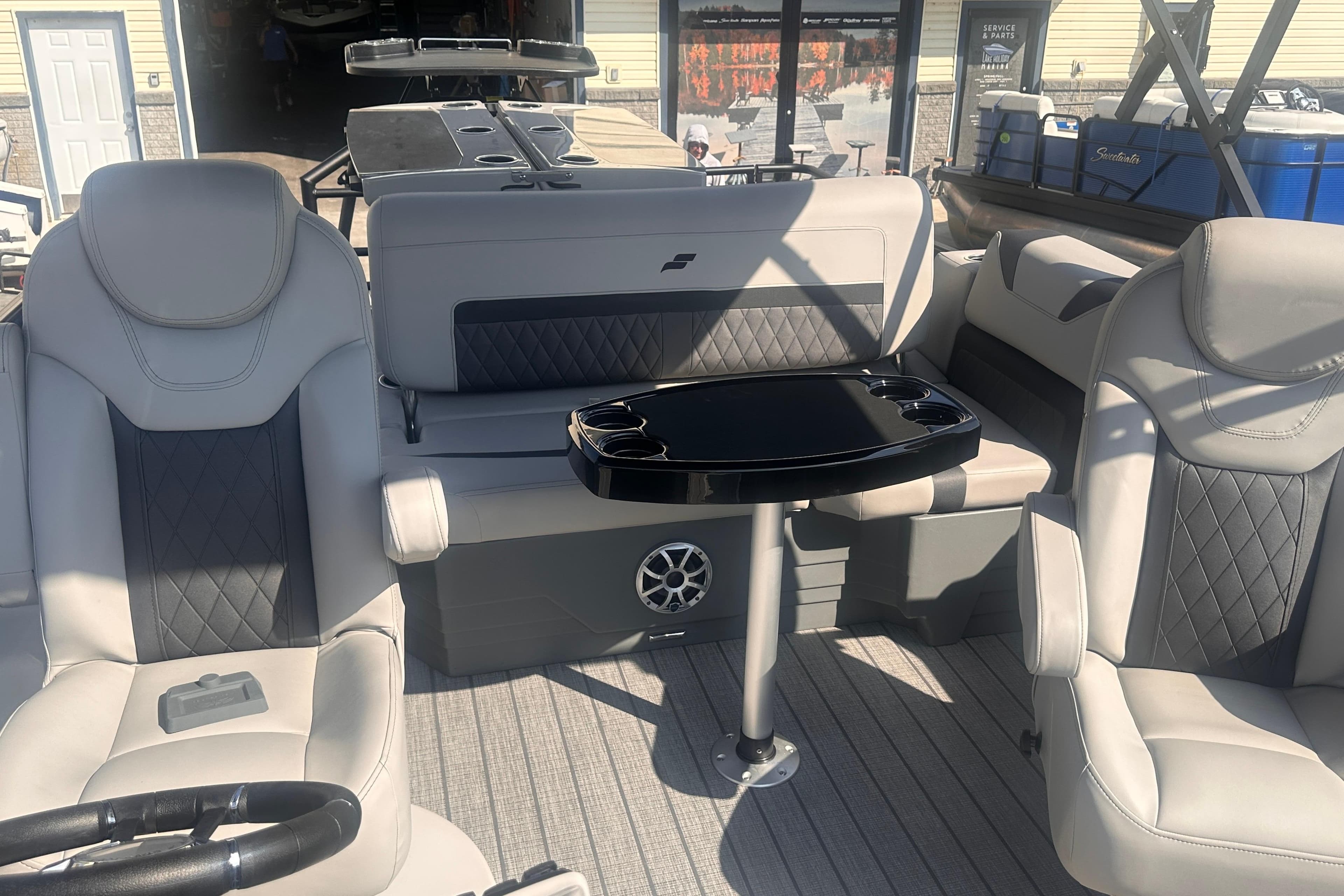 2026 Starcraft CX 23 DL BAR boat interior with luxurious seating and table.