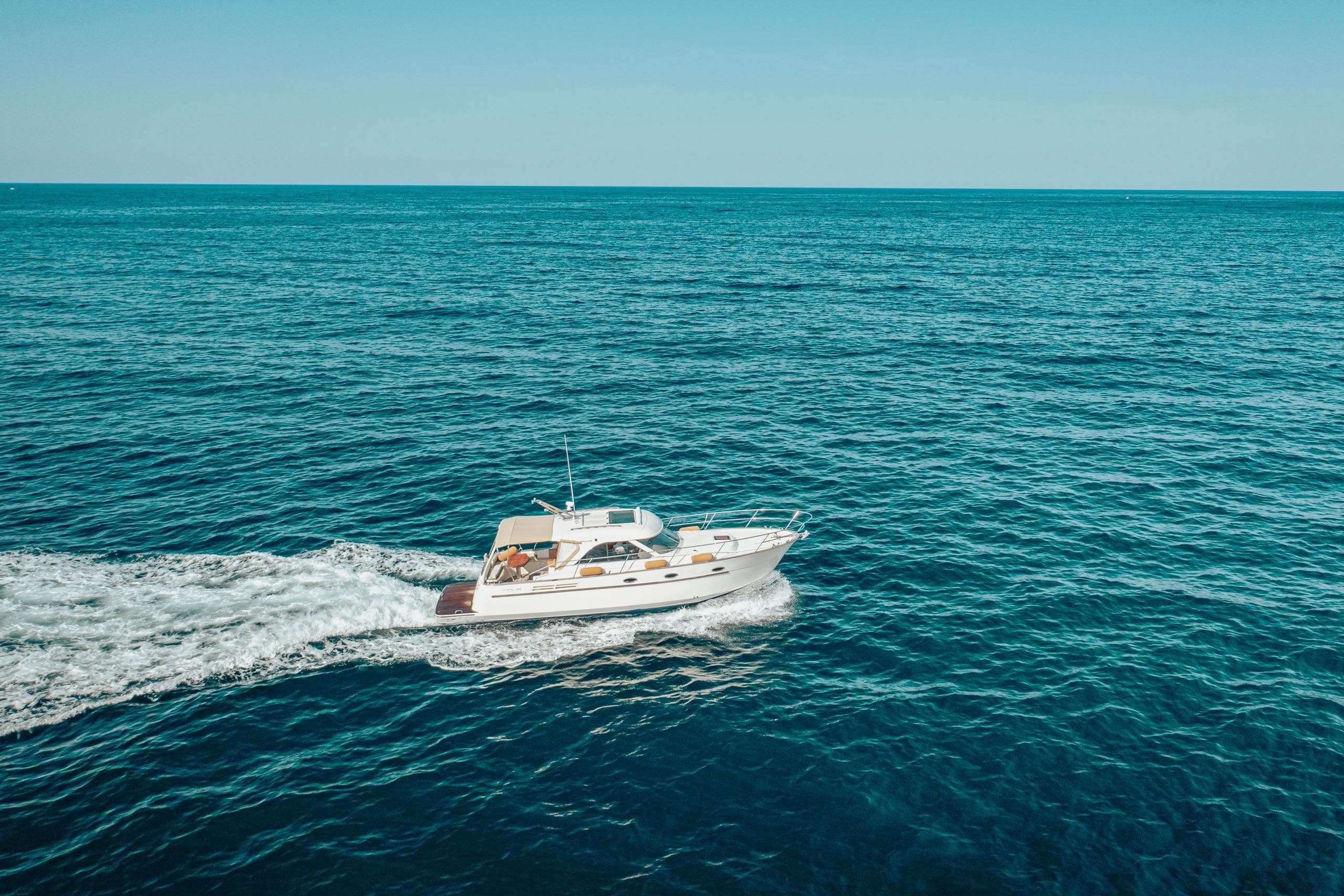 2006 Arcoa Mystic 39 yacht cruising on open blue sea.