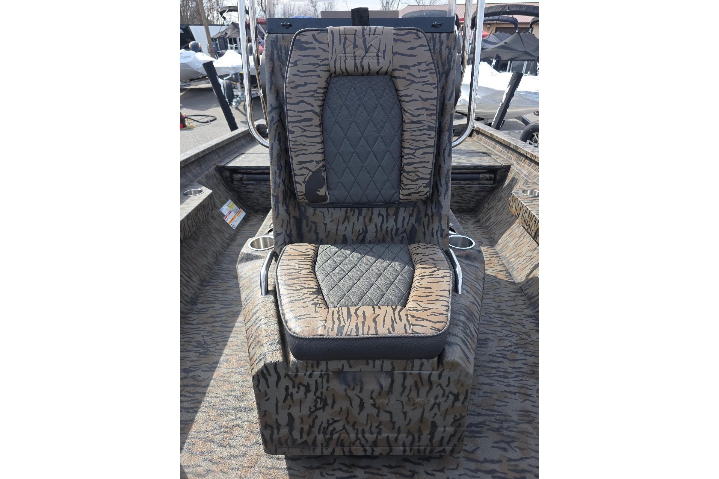 2026 Xpress H20B Bay boat seat with camouflage pattern and diamond-stitched upholstery.