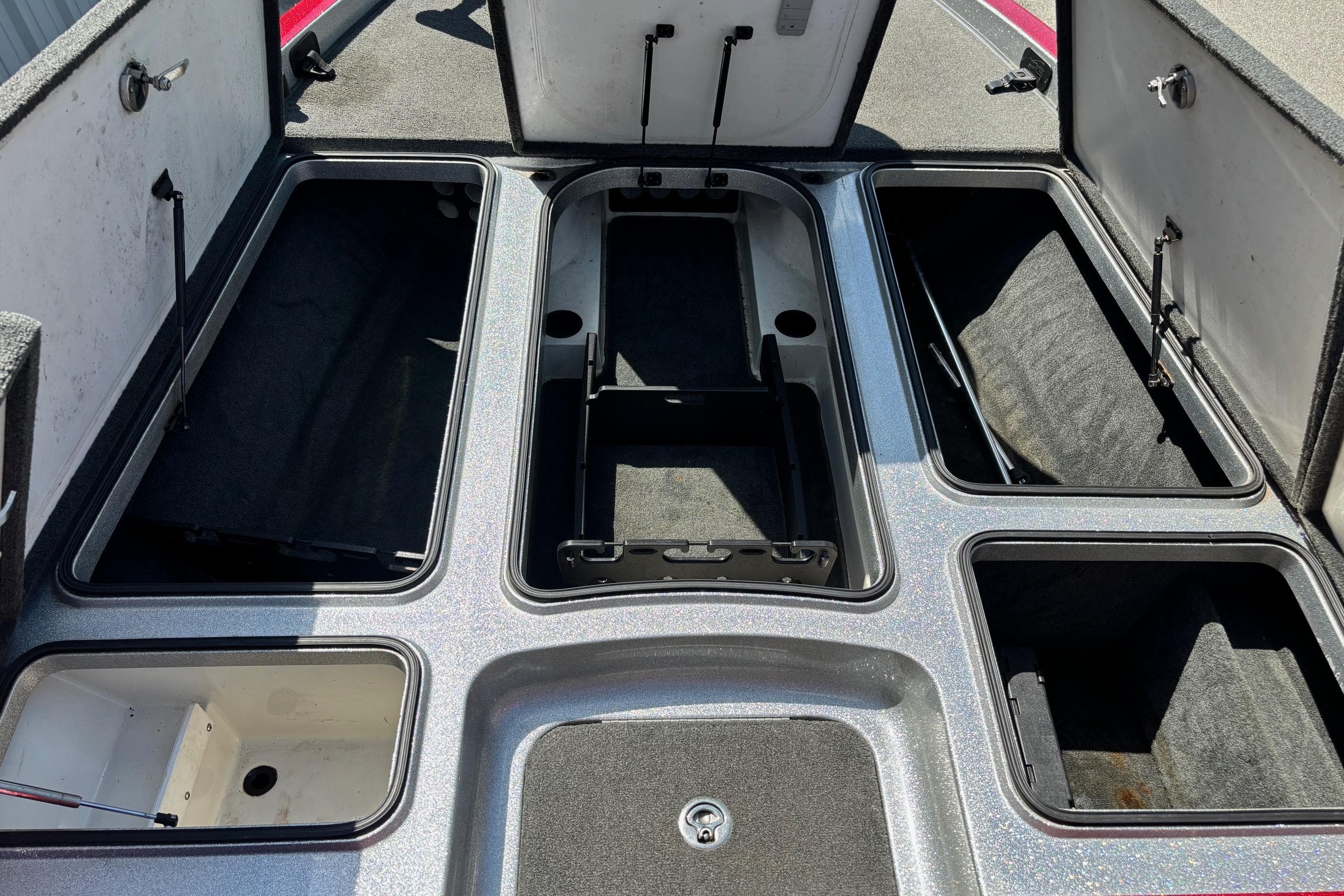Interior view of a 2015 Ranger Z522 Comanche with open storage compartments.
