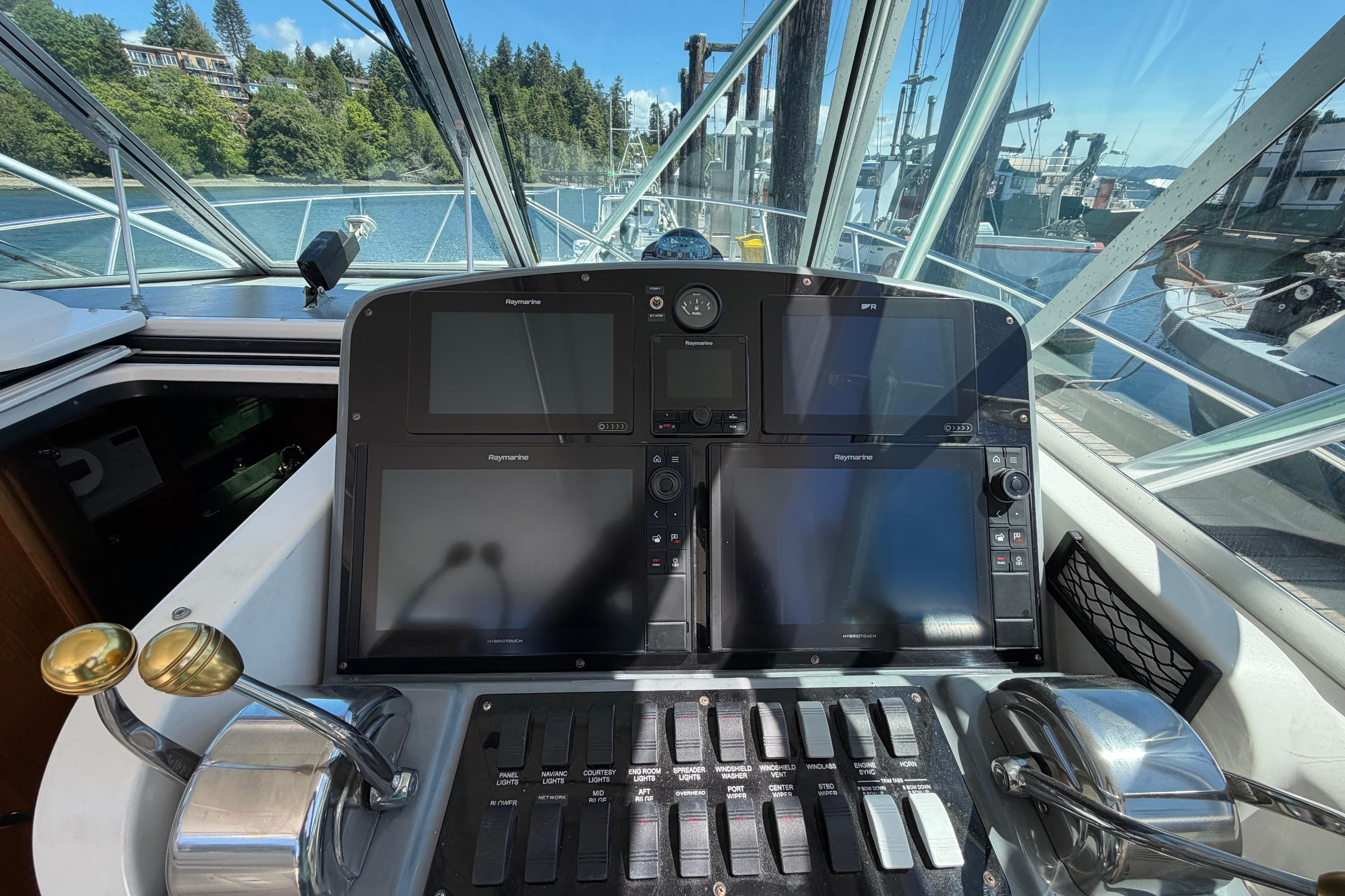 Helm of 2000 Pursuit 3400 Express with navigation equipment and controls.