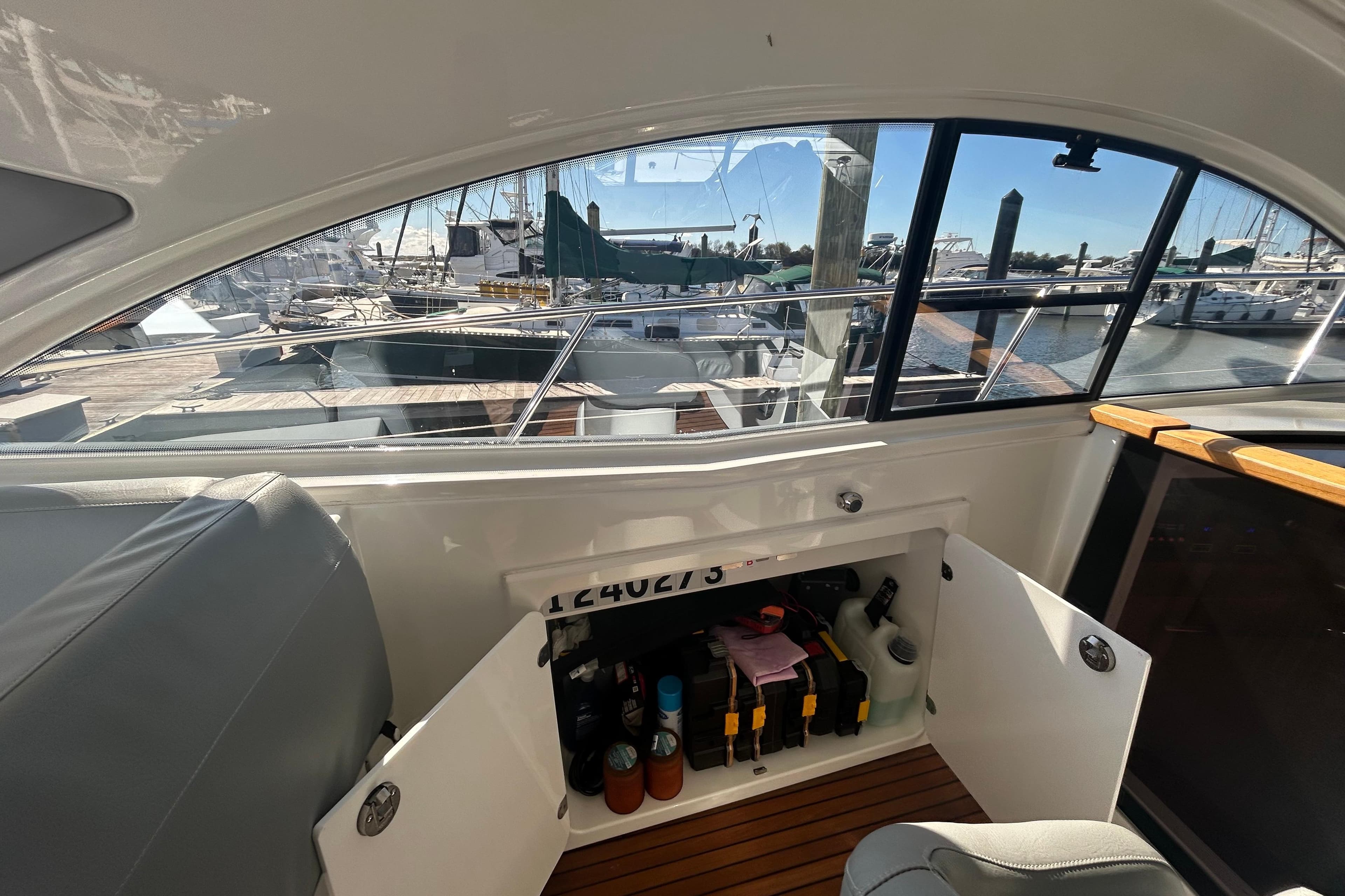 Interior view of a 2012 Beneteau Gran Turismo 44 yacht, showcasing storage compartment.