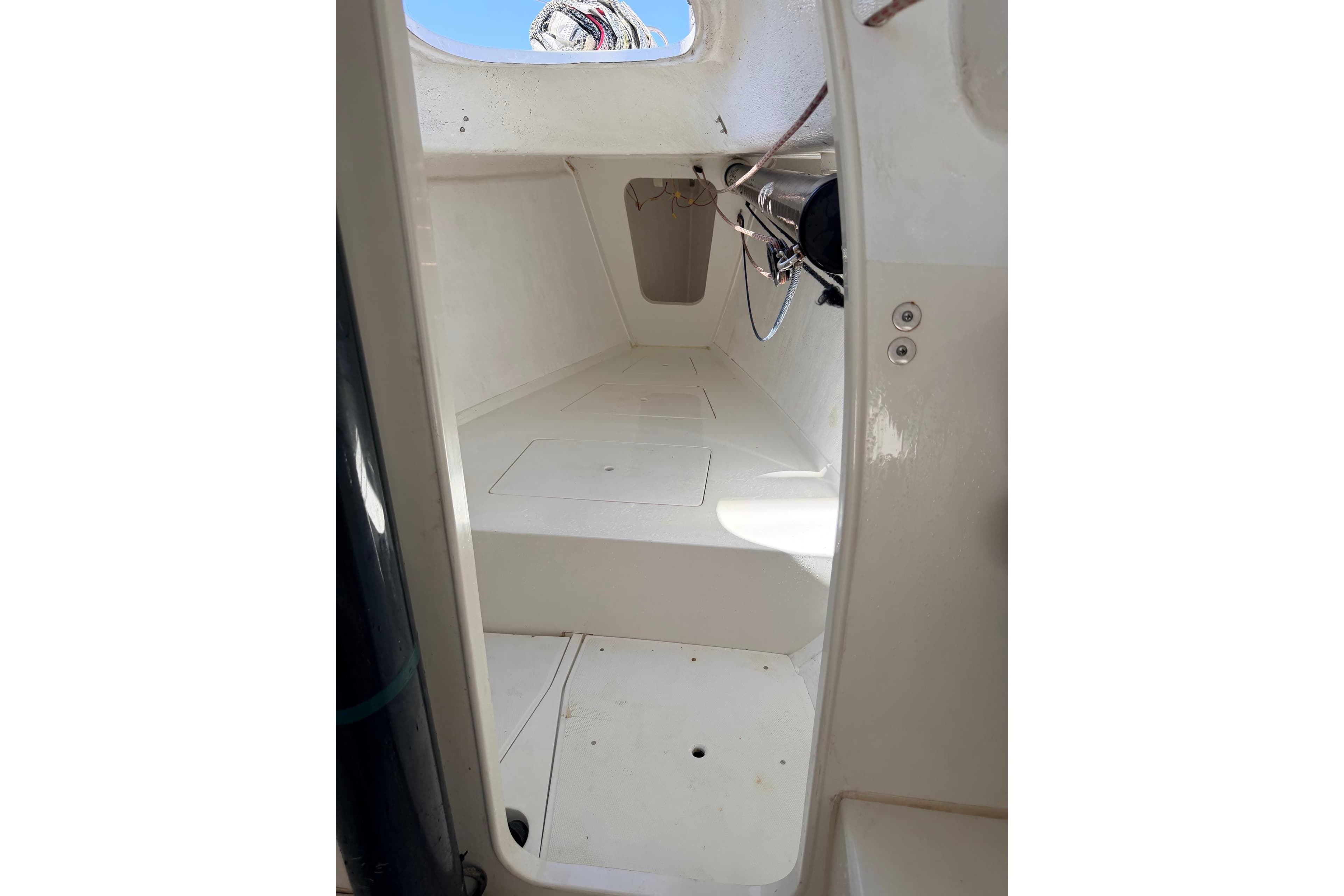 Interior view of a 2007 Flying Tiger 10M sailboat, showcasing clean white surfaces.